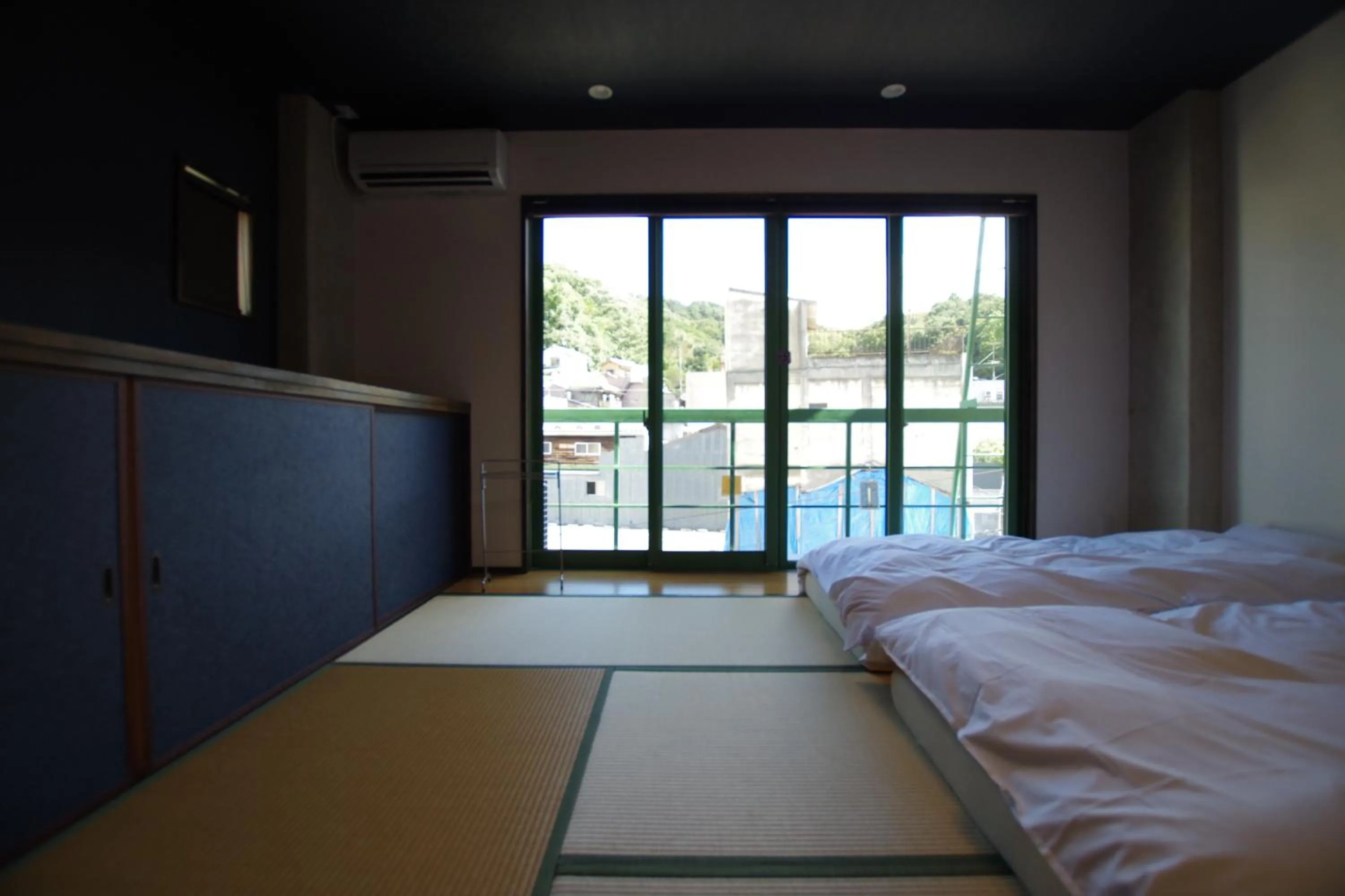 Bed in Cinnamon Guesthouse Dogo