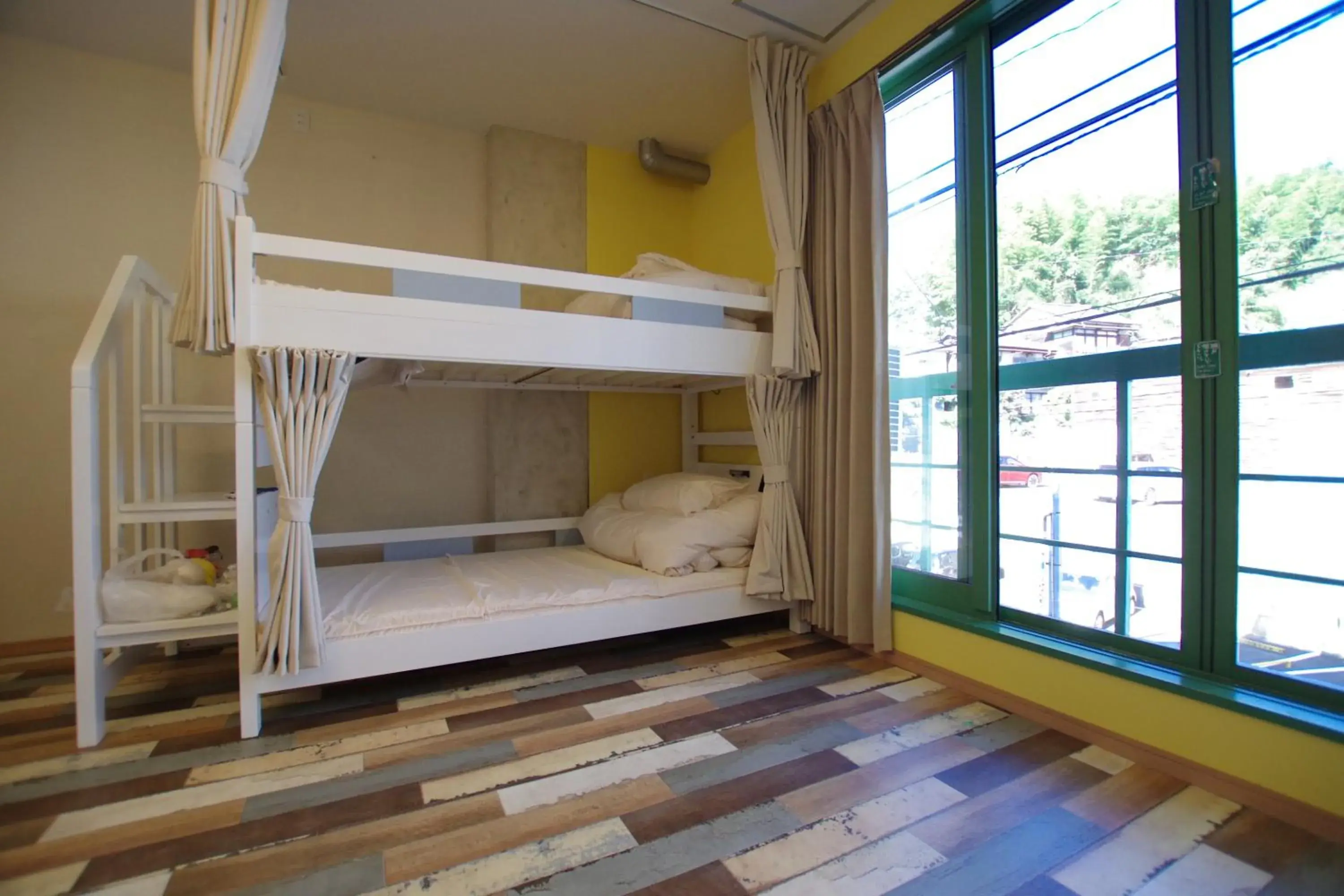 Bed in Cinnamon Guesthouse Dogo Bed in Cinnamon Guesthouse Dogo