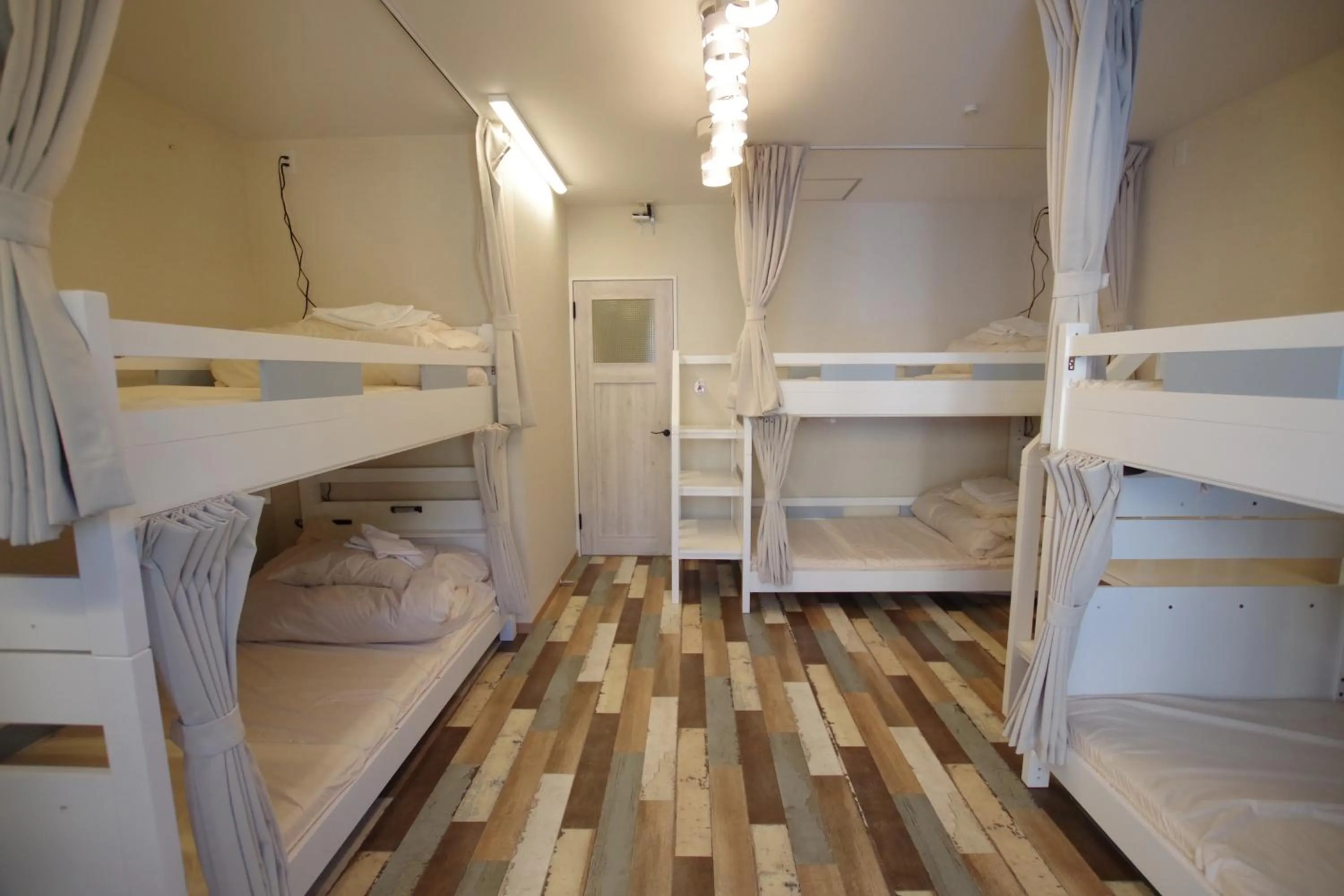 Bed in Cinnamon Guesthouse Dogo