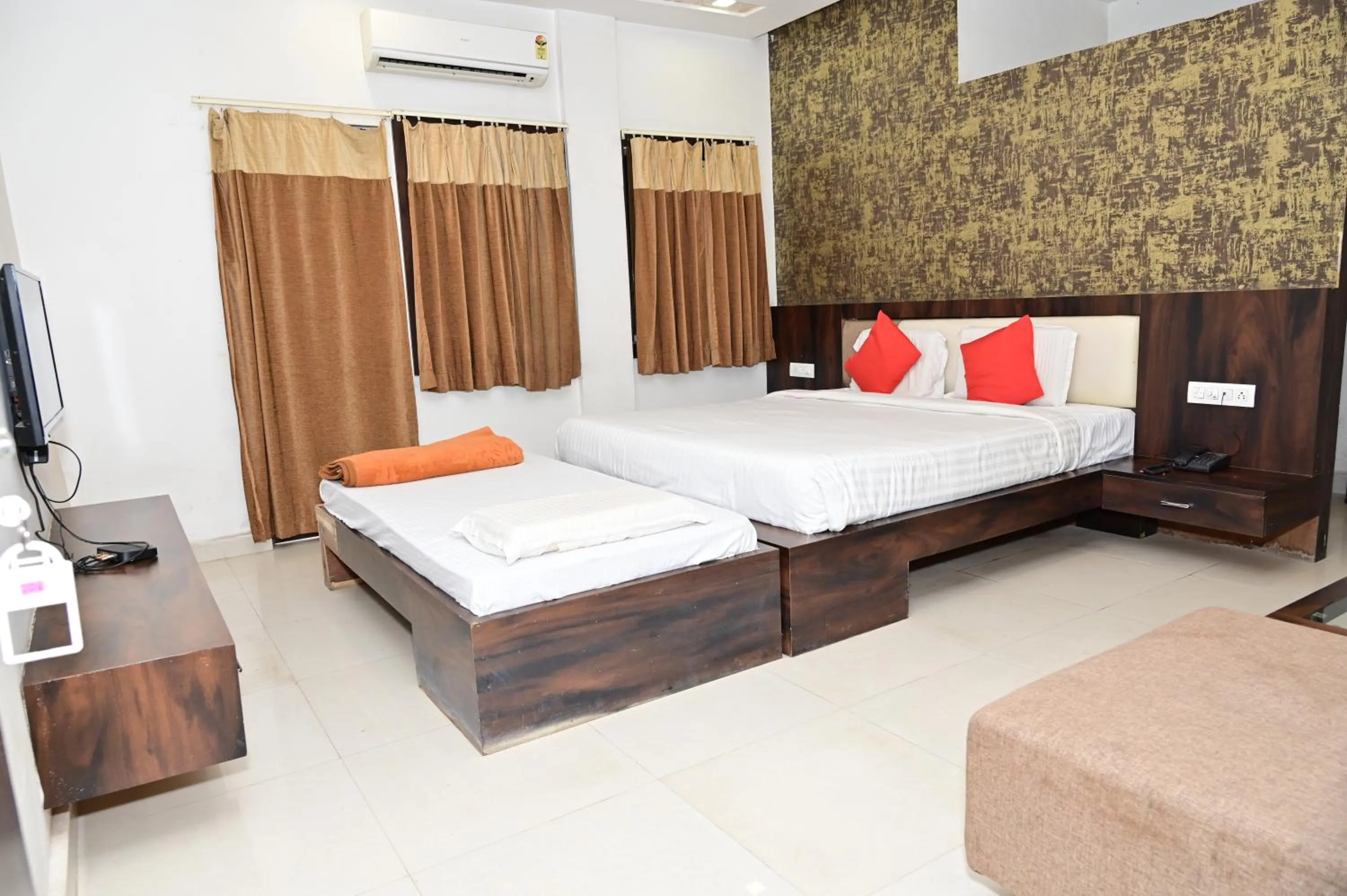 Bed in Sri Shivam Hotel