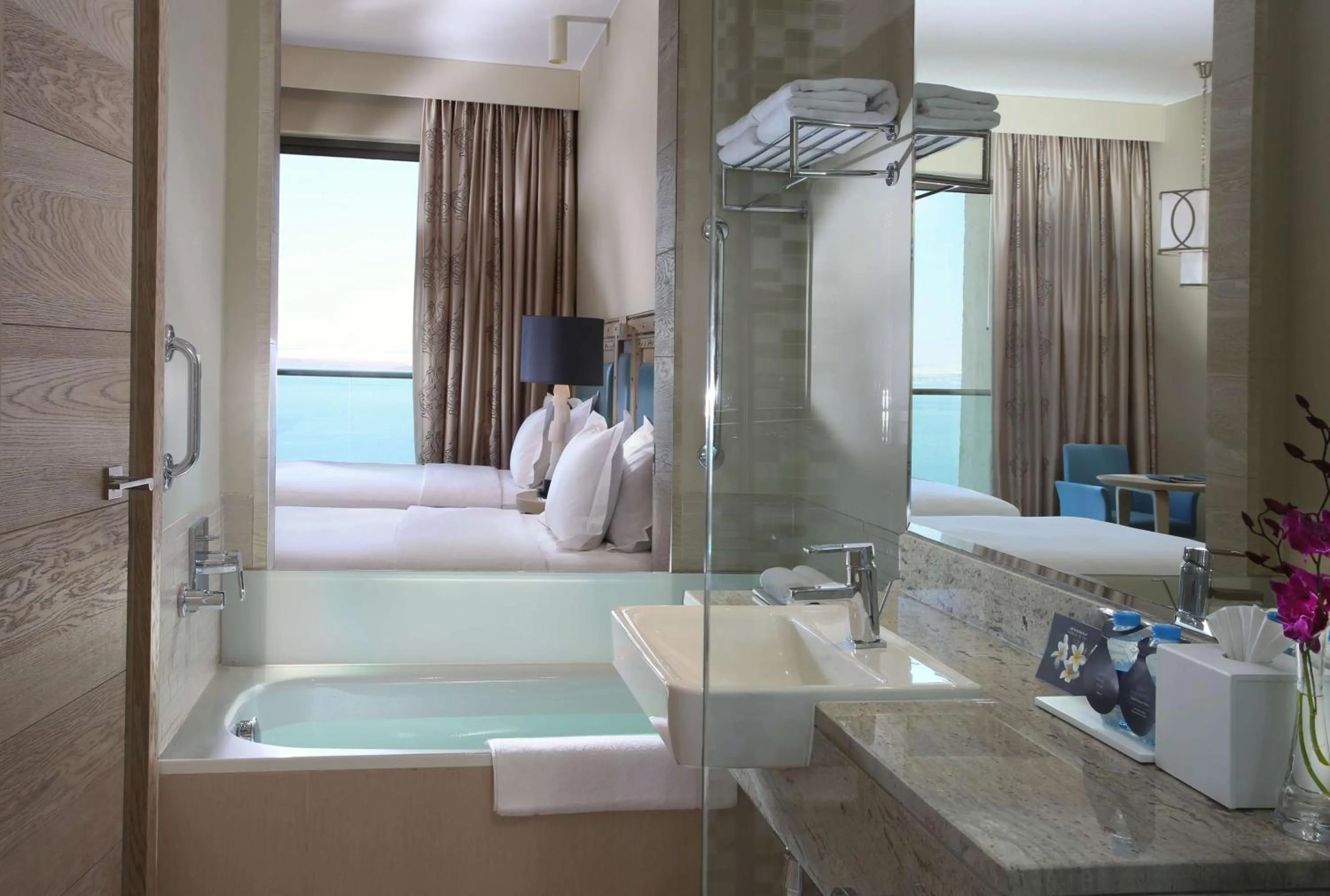 Bathroom, Bed in Hilton Dead Sea Resort & Spa