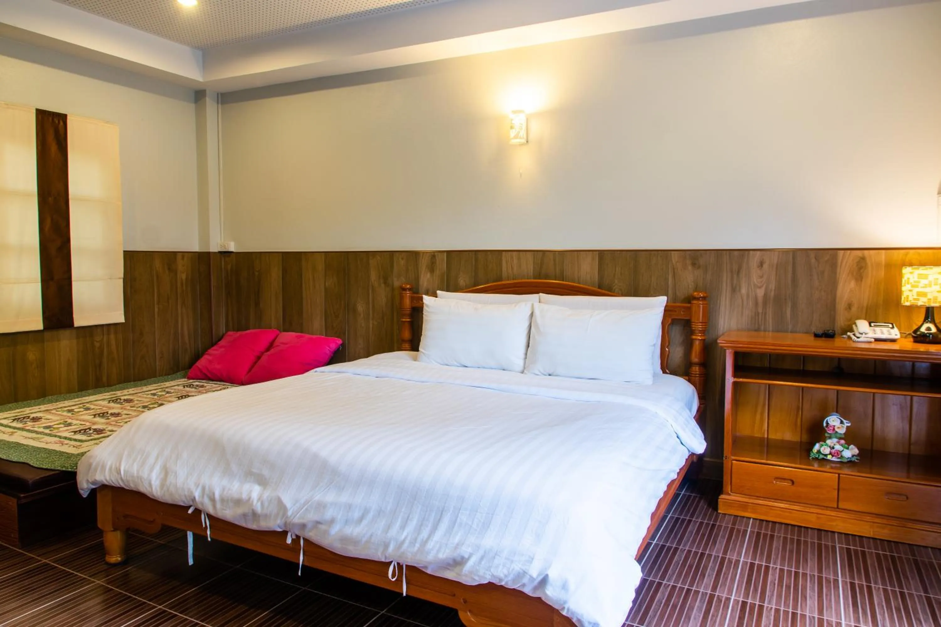 Bed in BaanRimNam Resort Trat