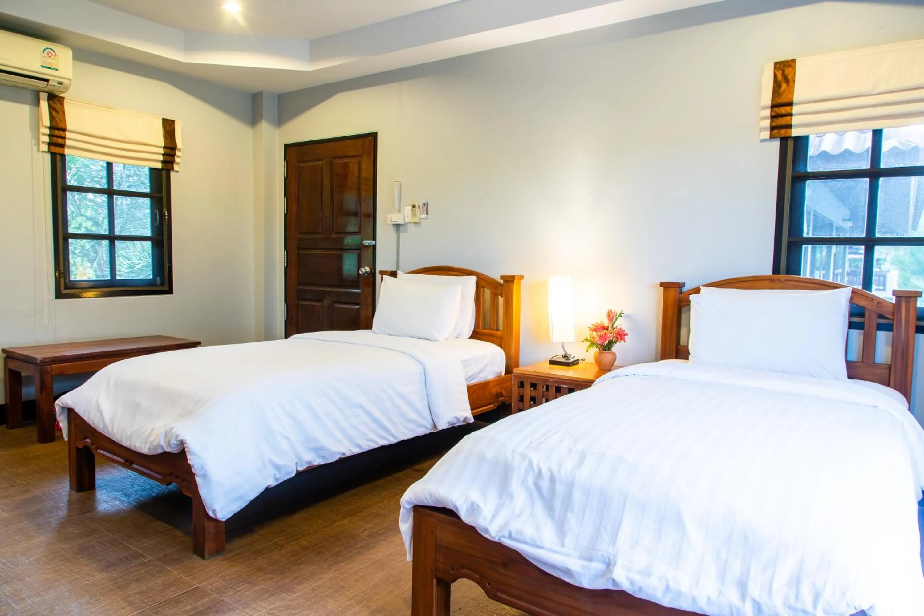 Bed in BaanRimNam Resort Trat