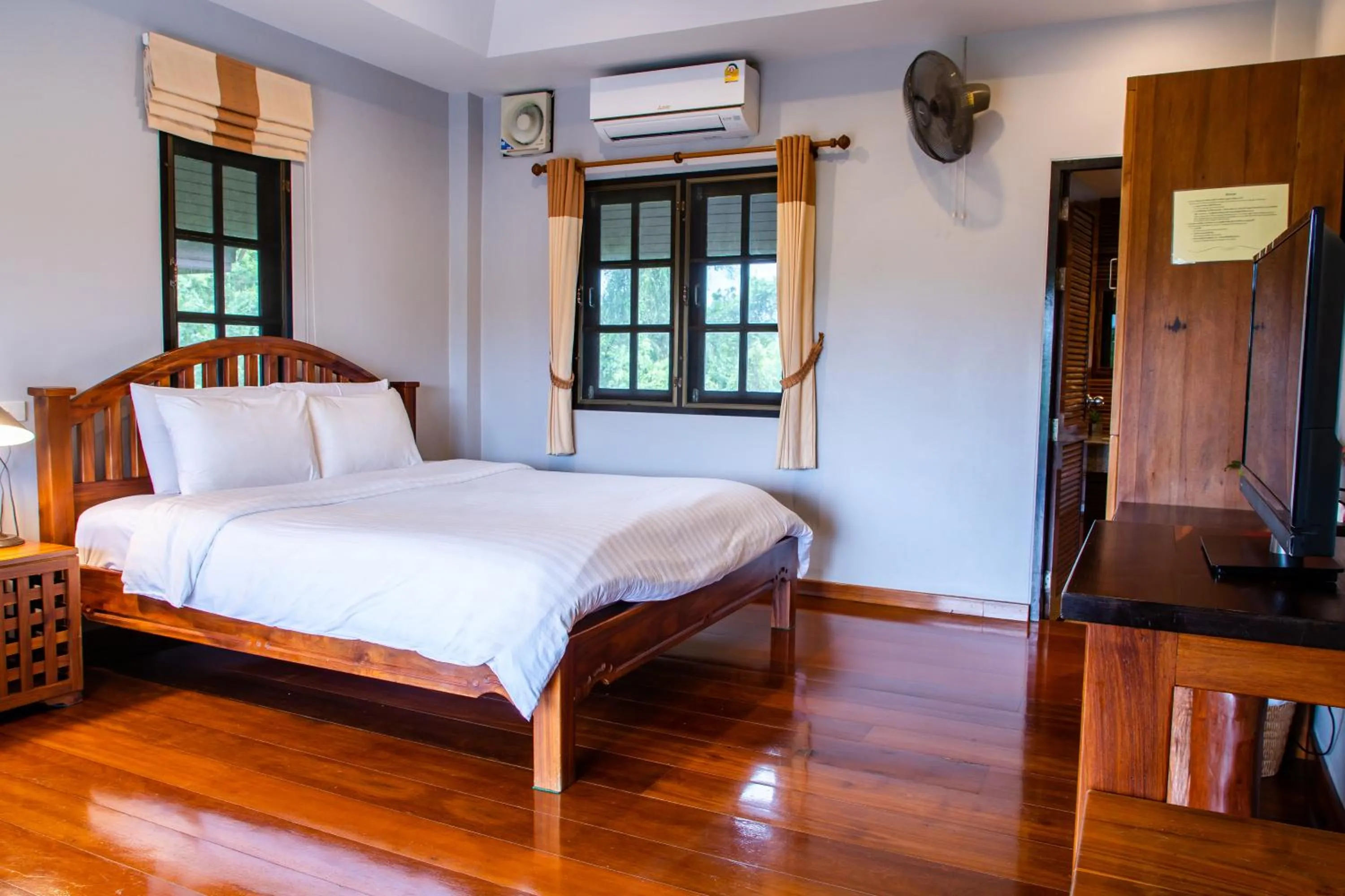 Bed in BaanRimNam Resort Trat