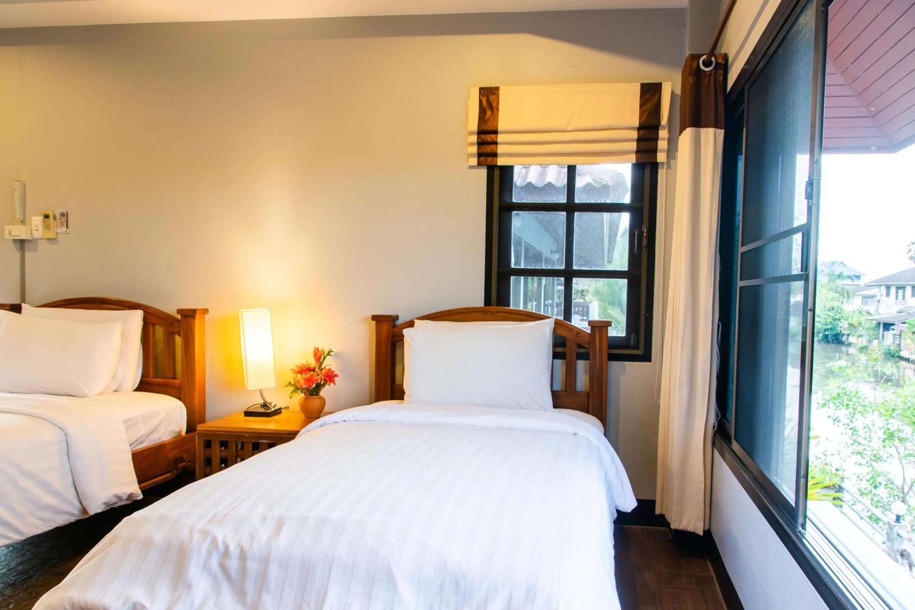 Bed in BaanRimNam Resort Trat