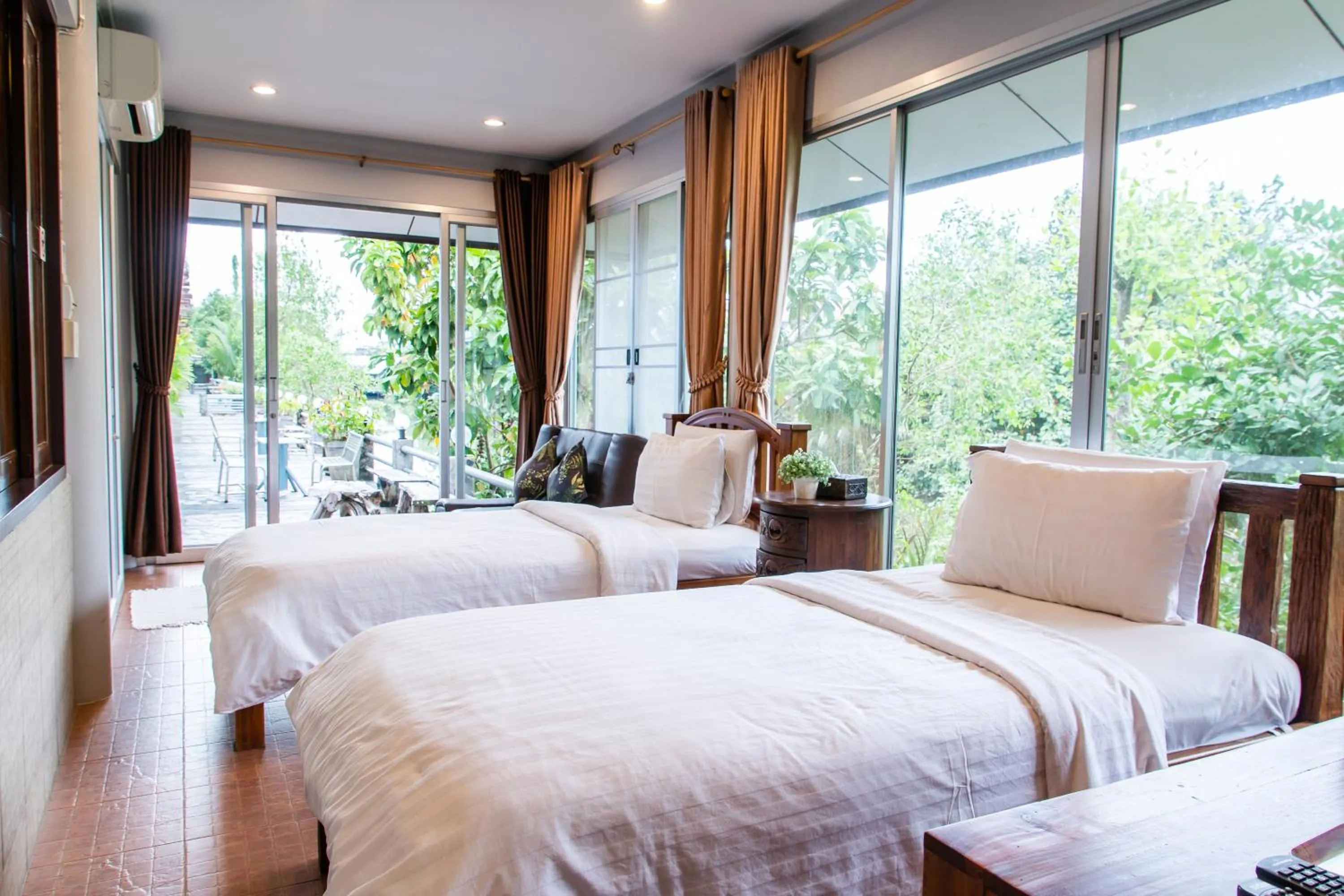 Bed in BaanRimNam Resort Trat