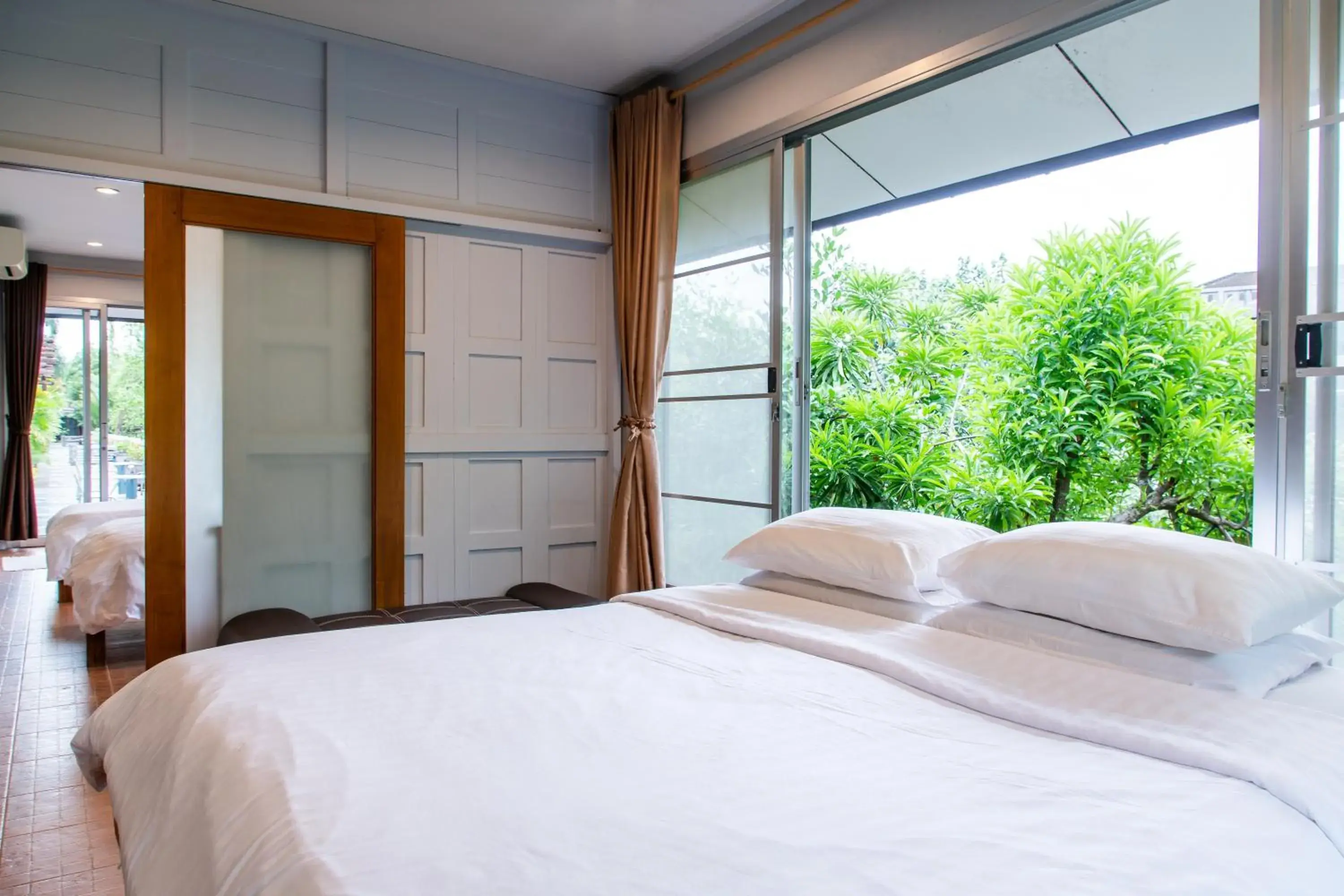 Bed in BaanRimNam Resort Trat Bed in BaanRimNam Resort Trat