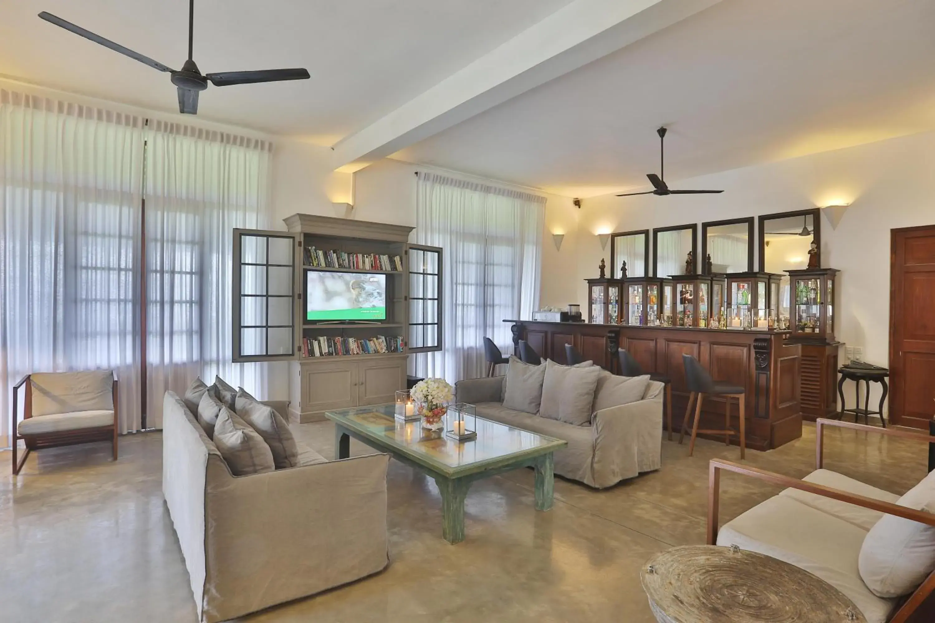 Lounge or bar in The Frangipani Tree by Edwards Collection Lounge or bar in The Frangipani Tree by Edwards Collection