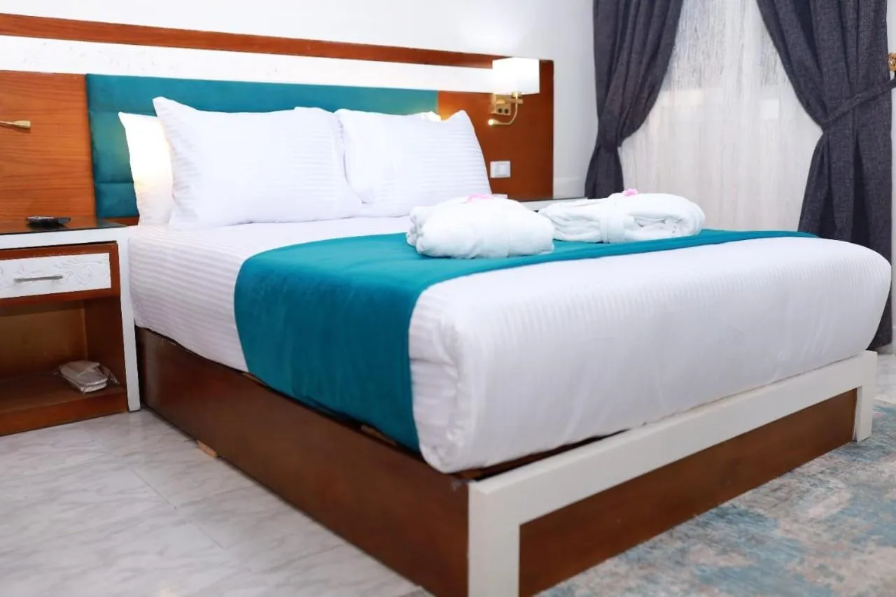 Bed in Asafra Hotel Apartments