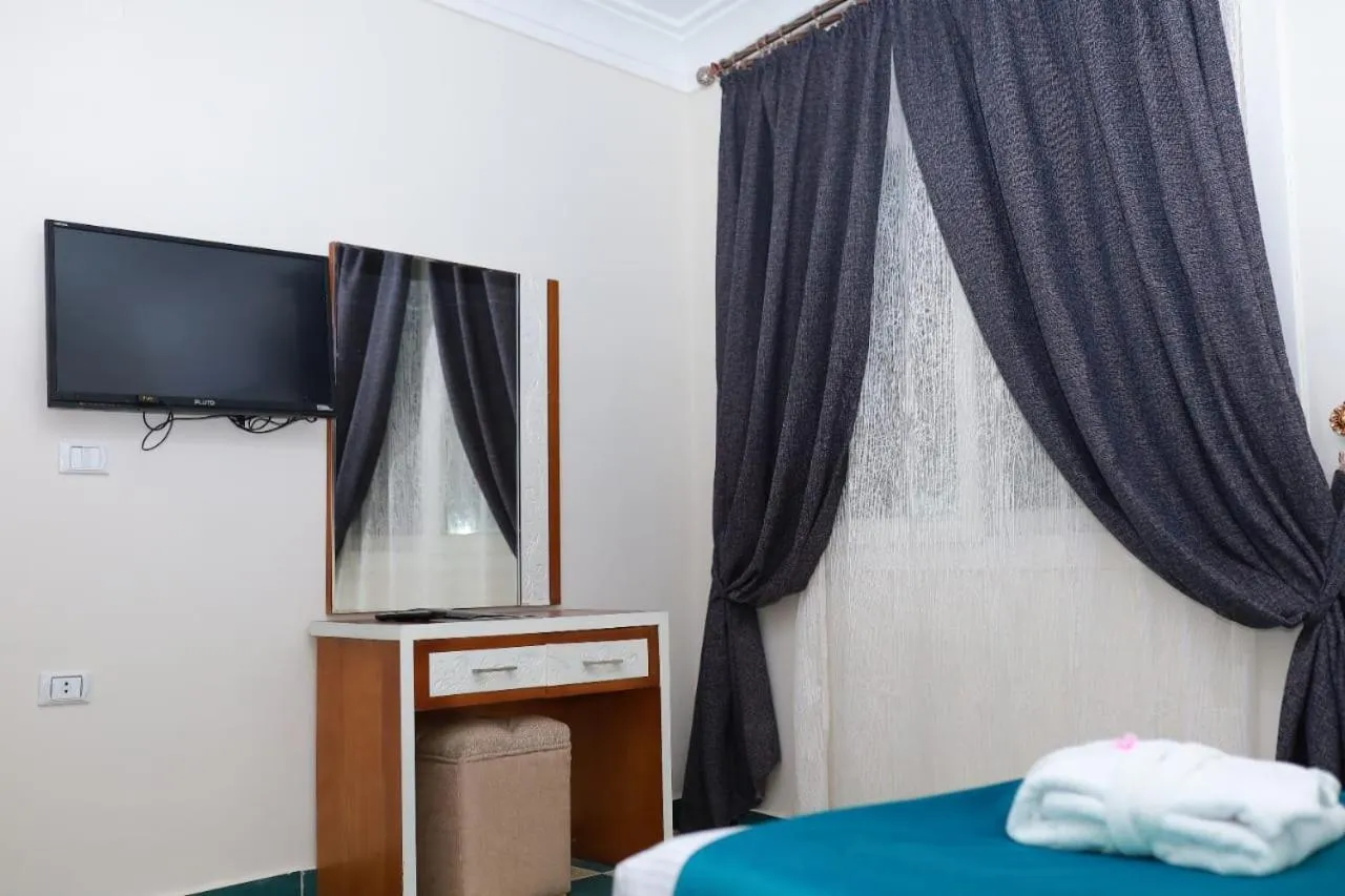 Bed in Asafra Hotel Apartments