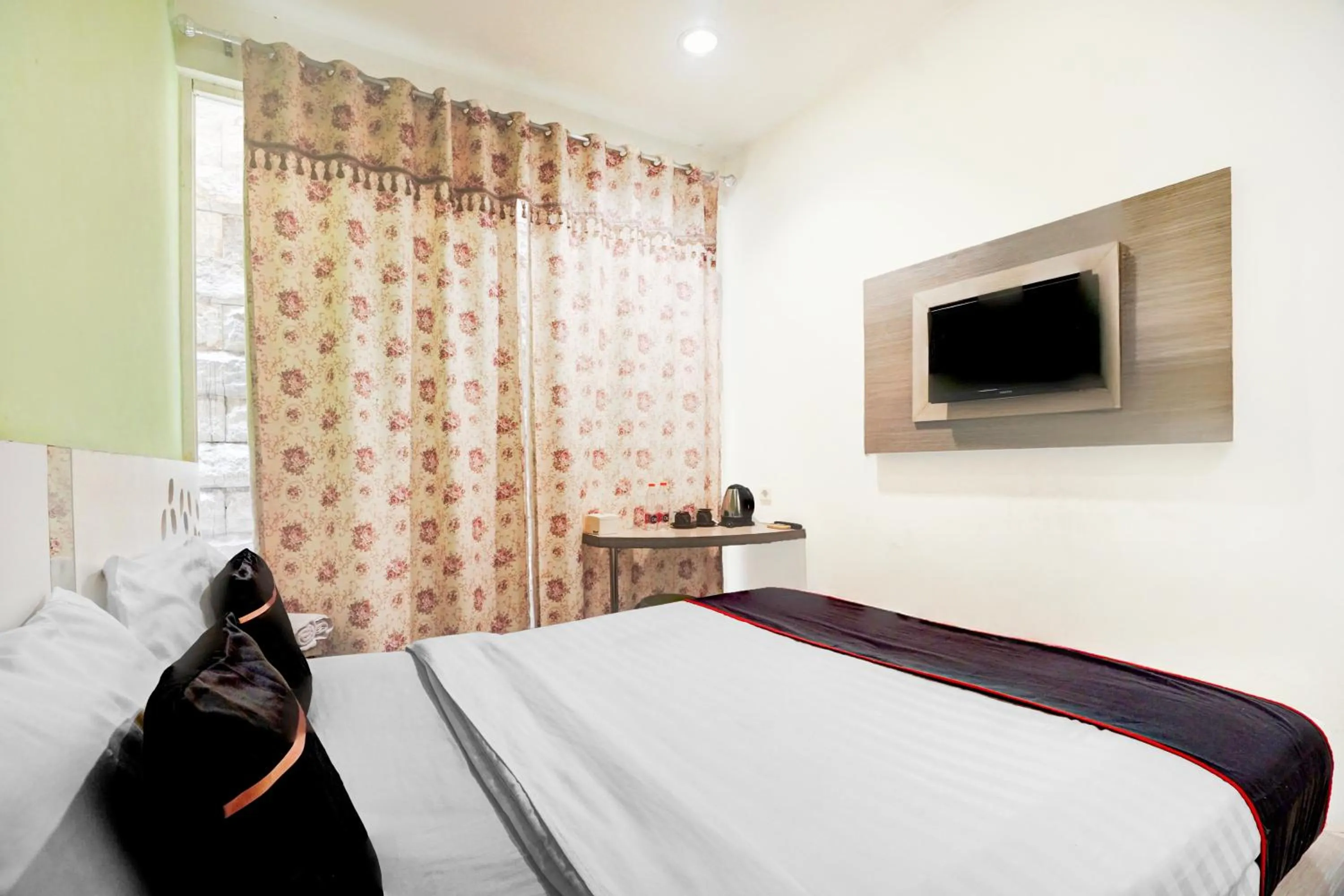 Bed in Hotel O Symphony Homestay Tlogomas