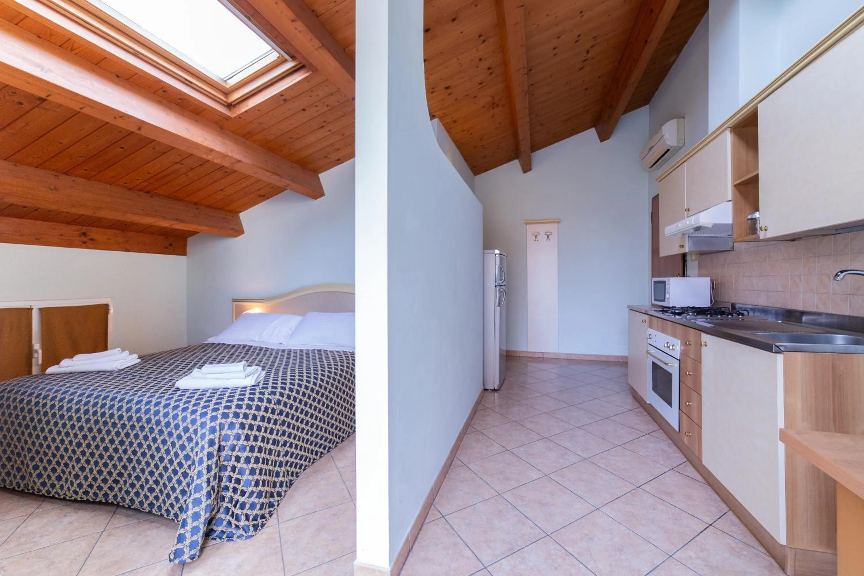 Kitchen or kitchenette, Bed in Residenza Melucci