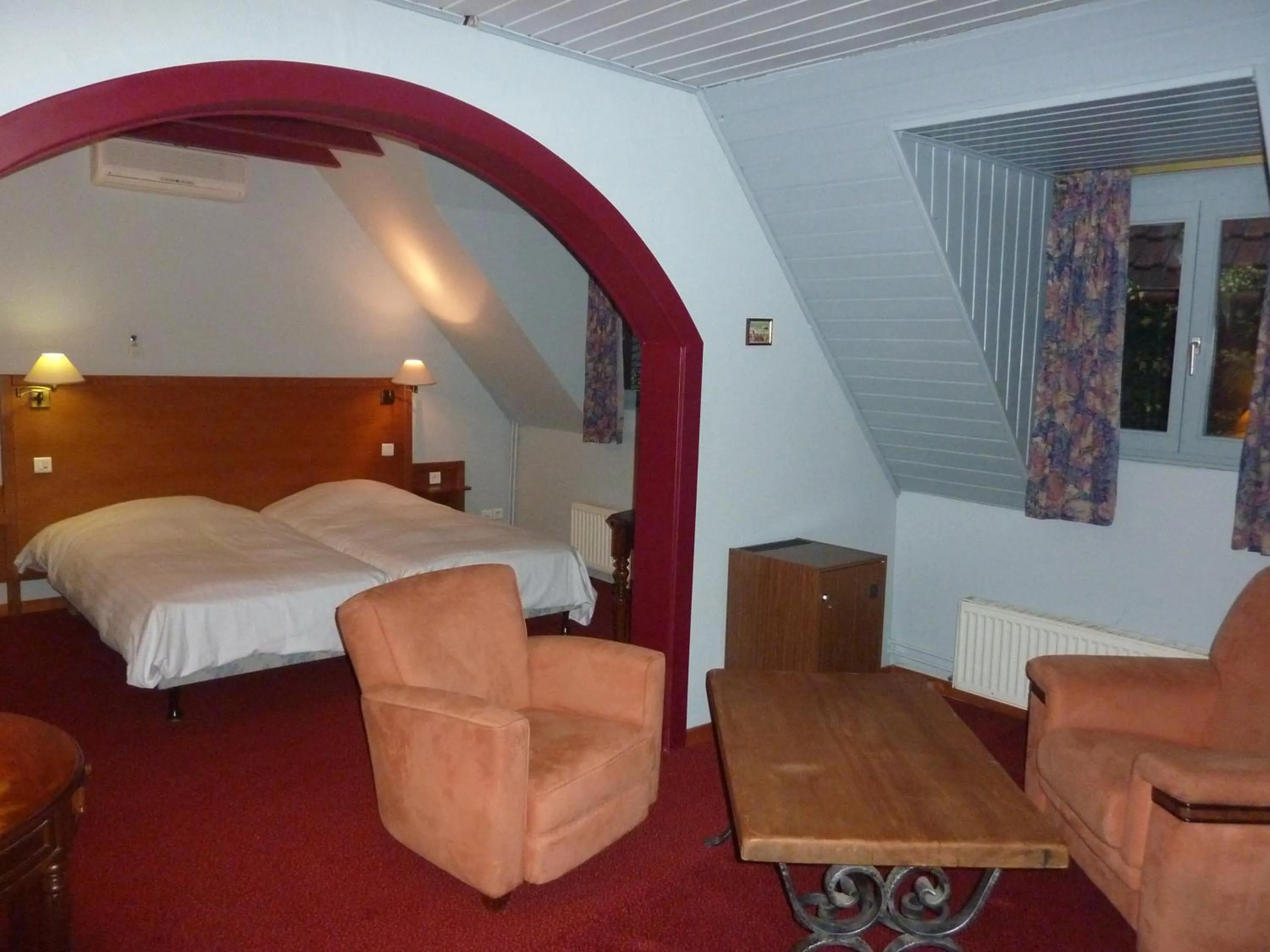 Seating area, Bed in Chez Norbert