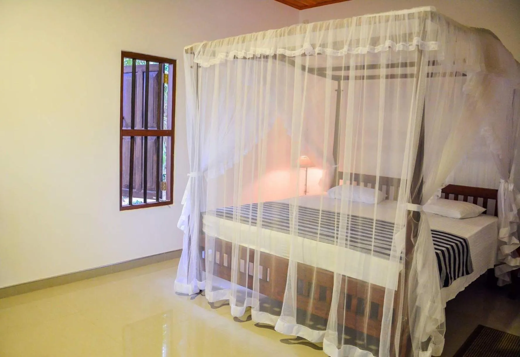 Bed in Shehani Beach Bungalow