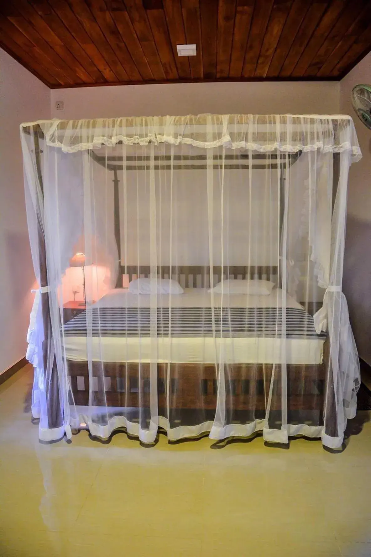 Bed in Shehani Beach Bungalow Bed in Shehani Beach Bungalow