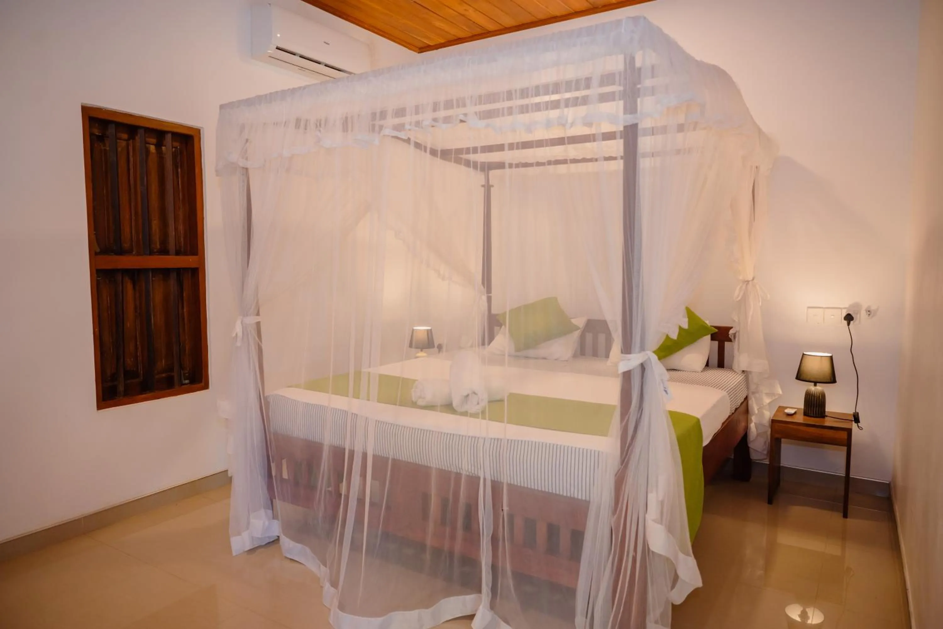Bed in Shehani Beach Bungalow