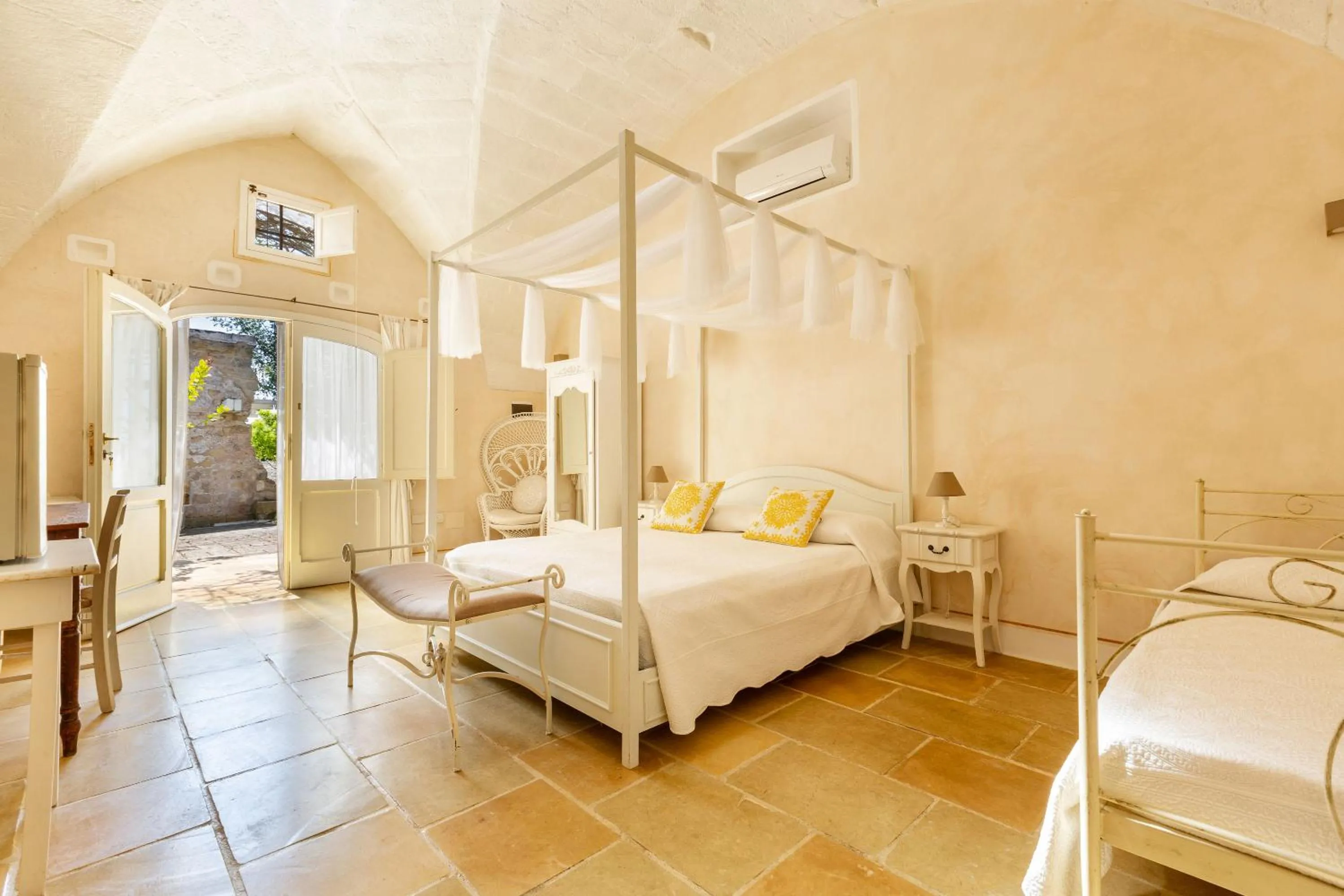 Bed in Masseria Li Capperi by Perle di Puglia