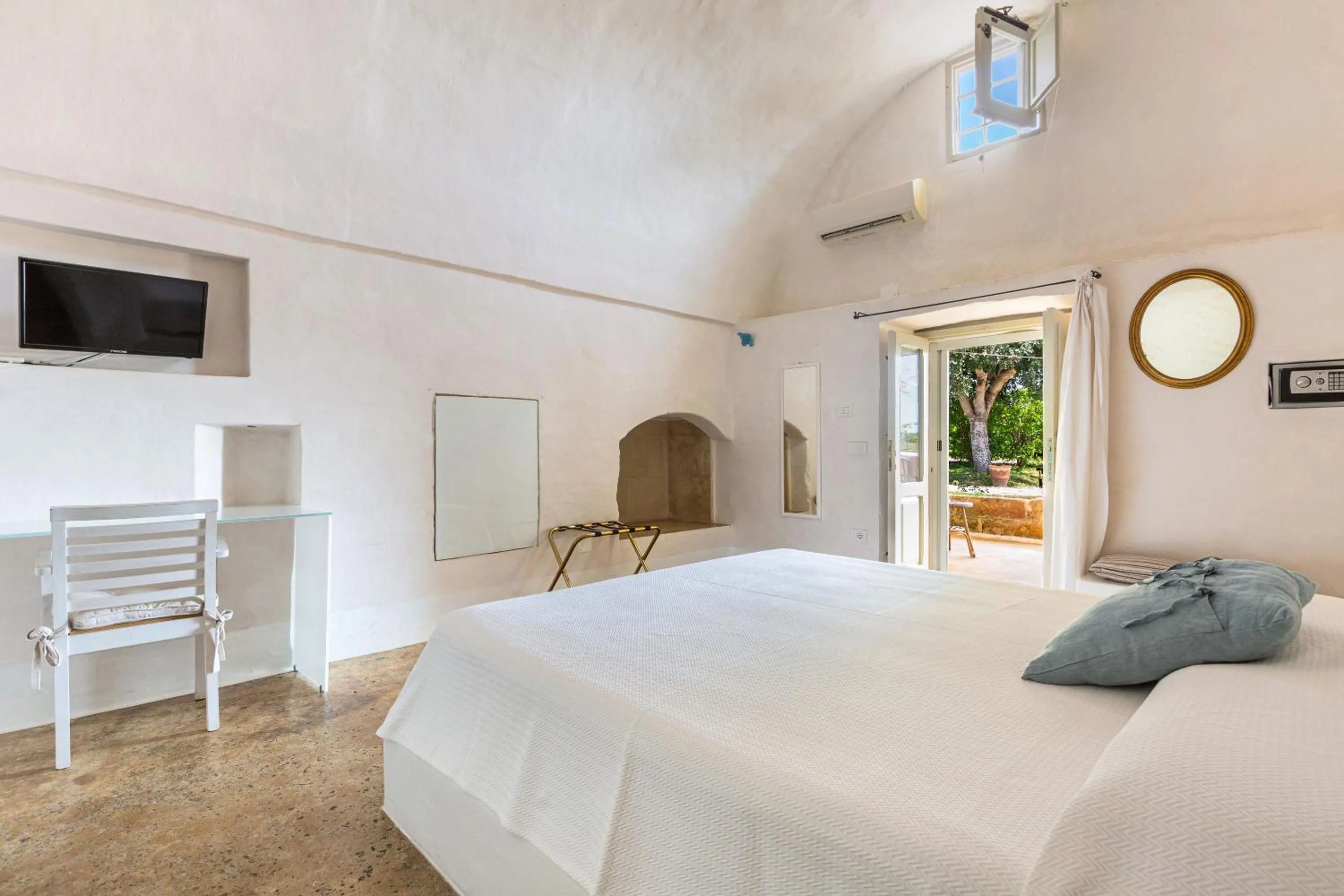Bed in Masseria Li Capperi by Perle di Puglia