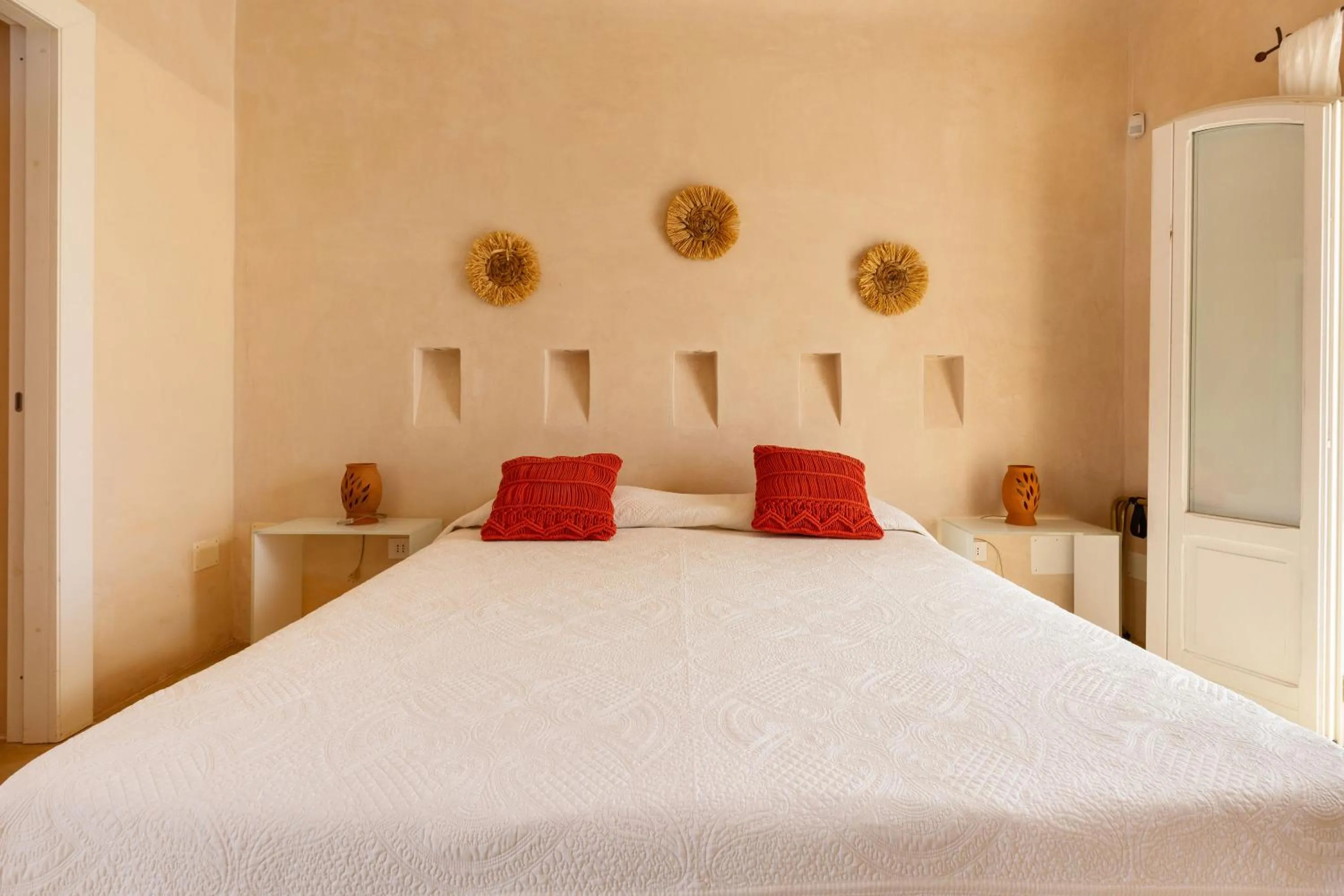 Bed in Masseria Li Capperi by Perle di Puglia