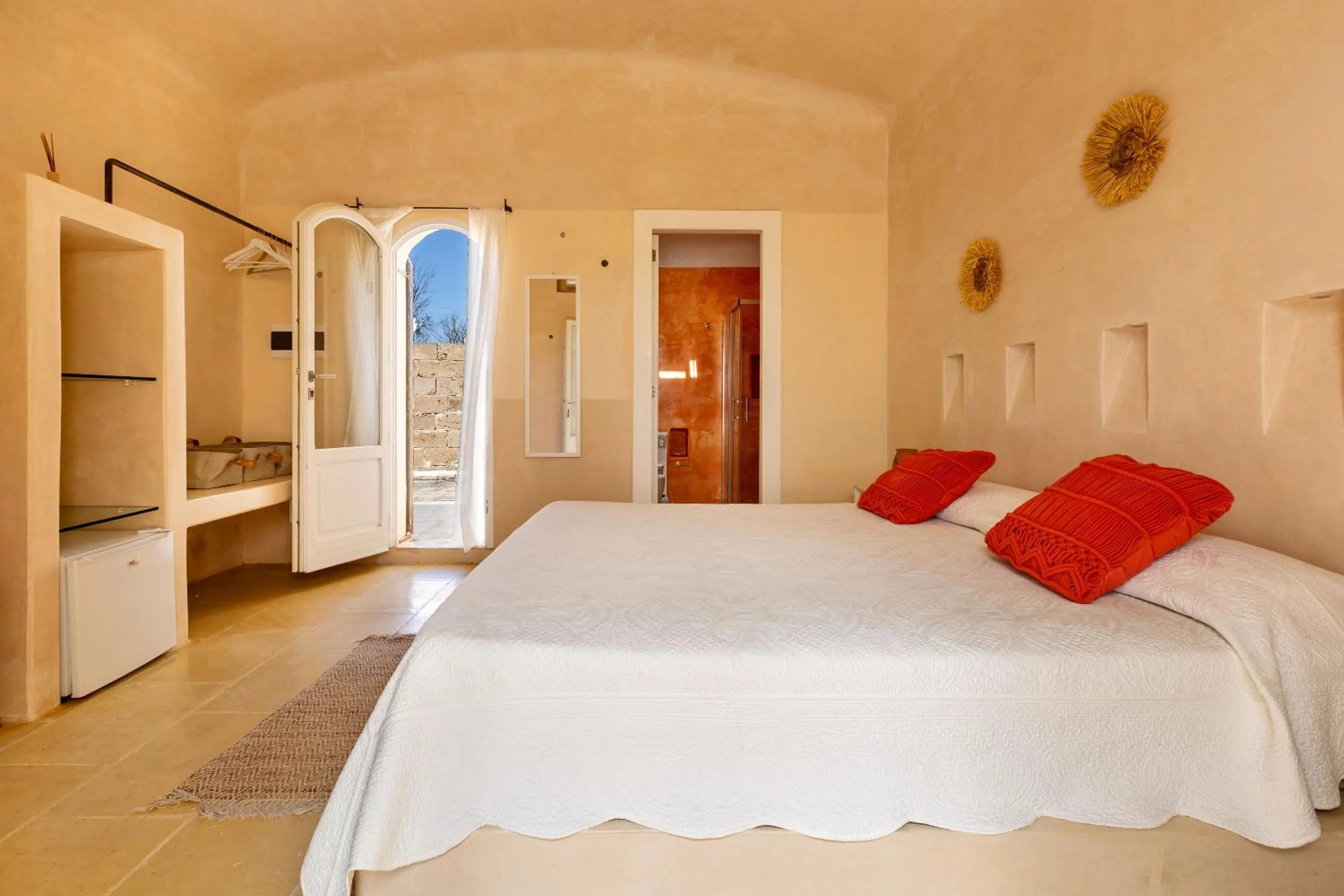 Bed in Masseria Li Capperi by Perle di Puglia