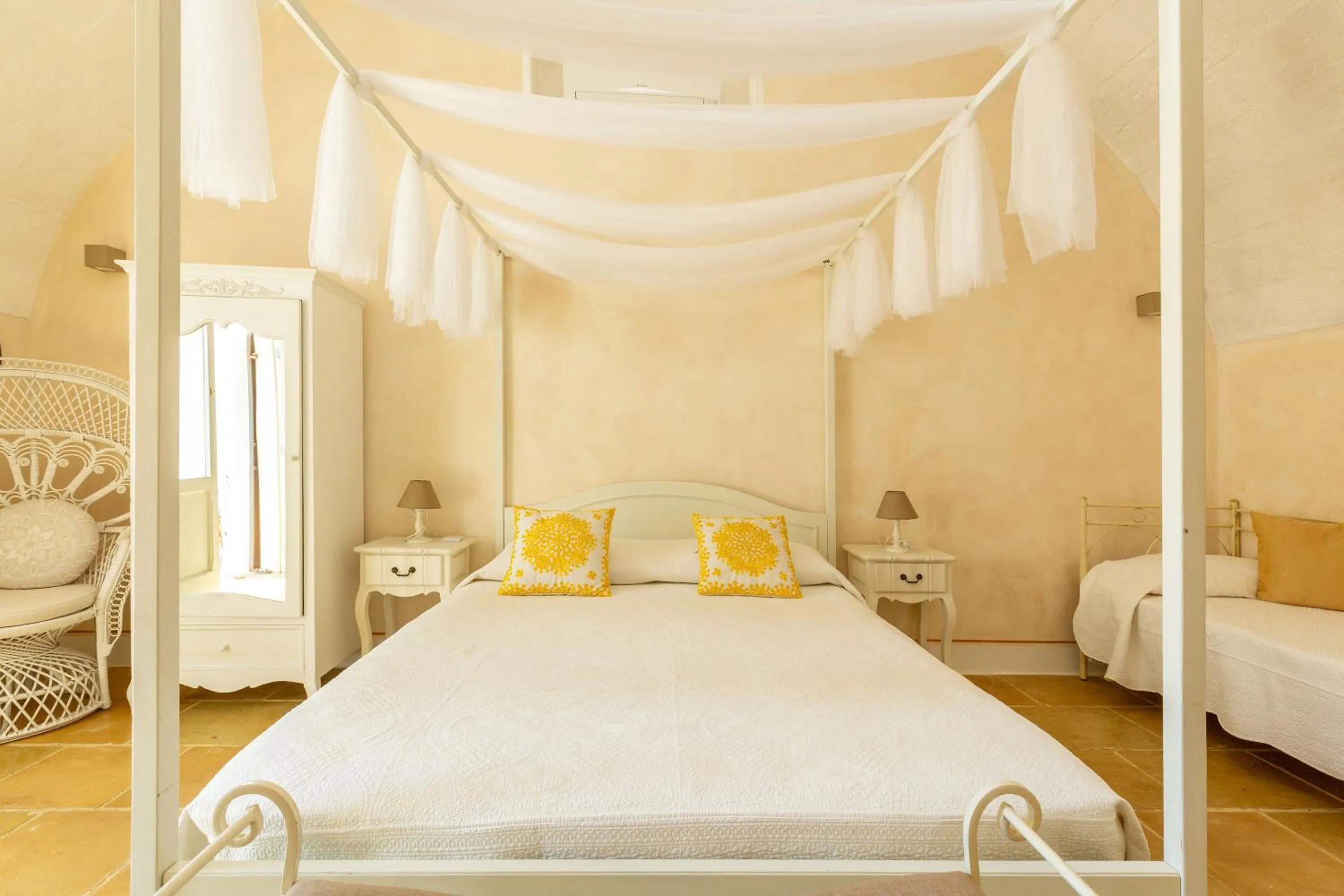 Bed in Masseria Li Capperi by Perle di Puglia
