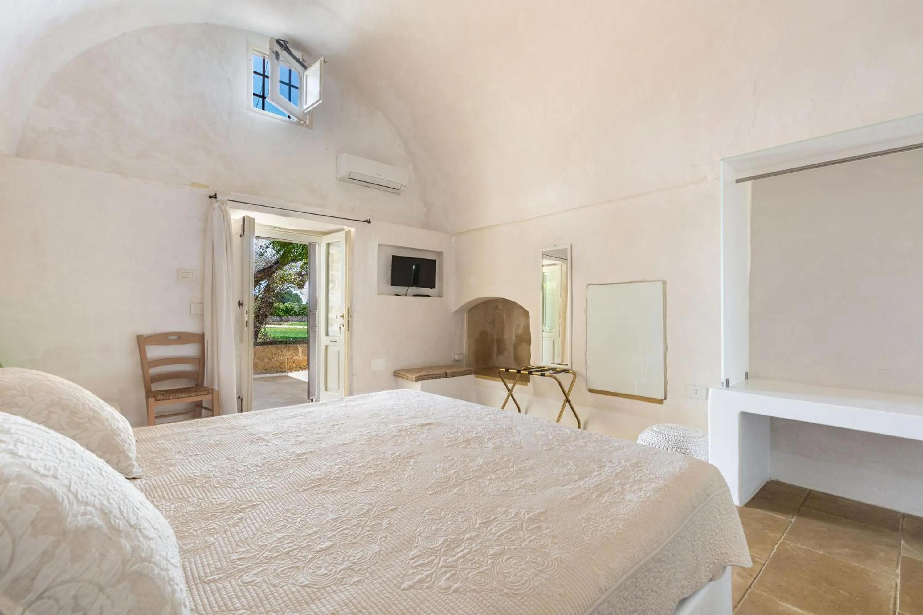 Bed in Masseria Li Capperi by Perle di Puglia