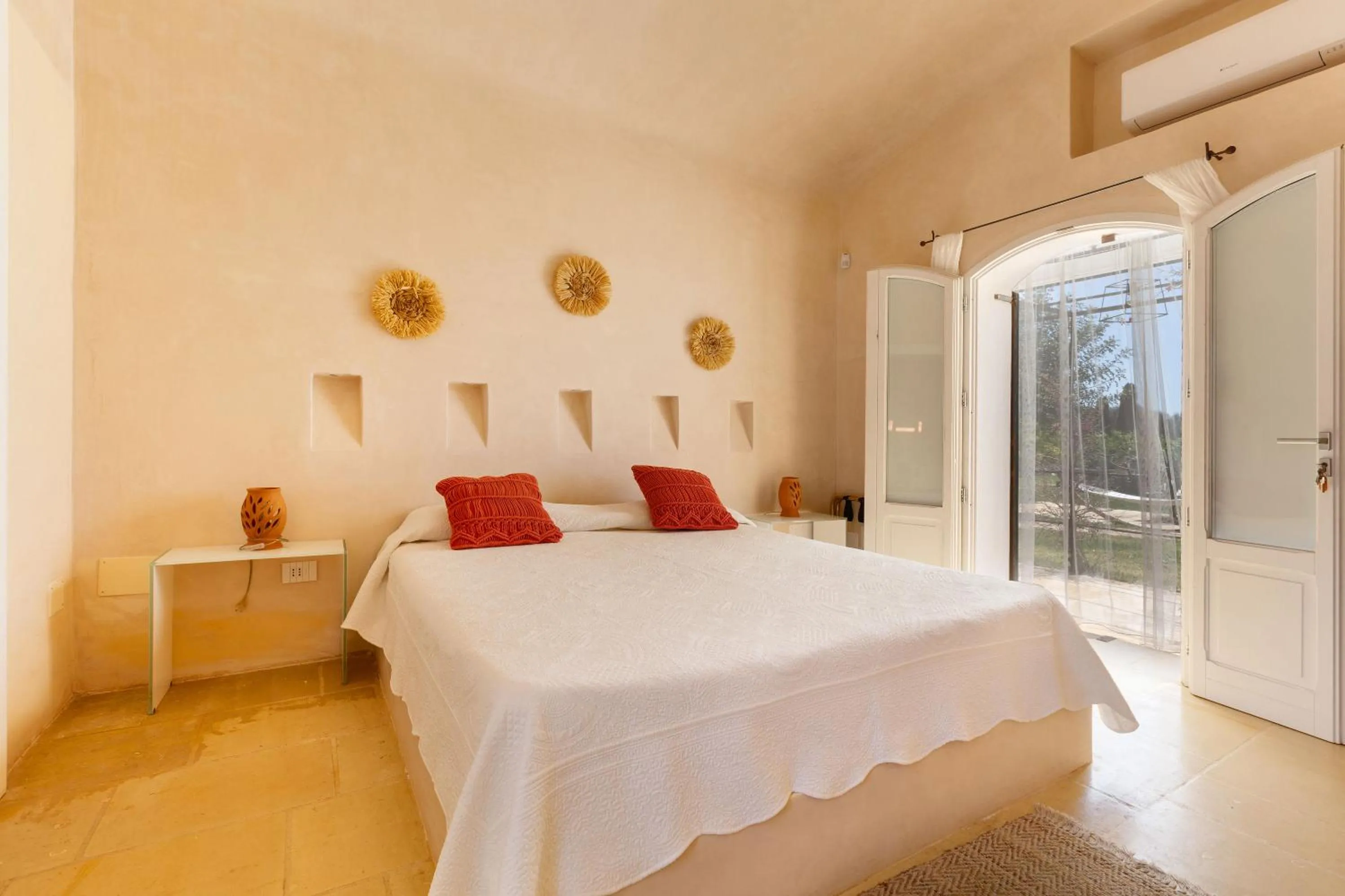 Bed in Masseria Li Capperi by Perle di Puglia
