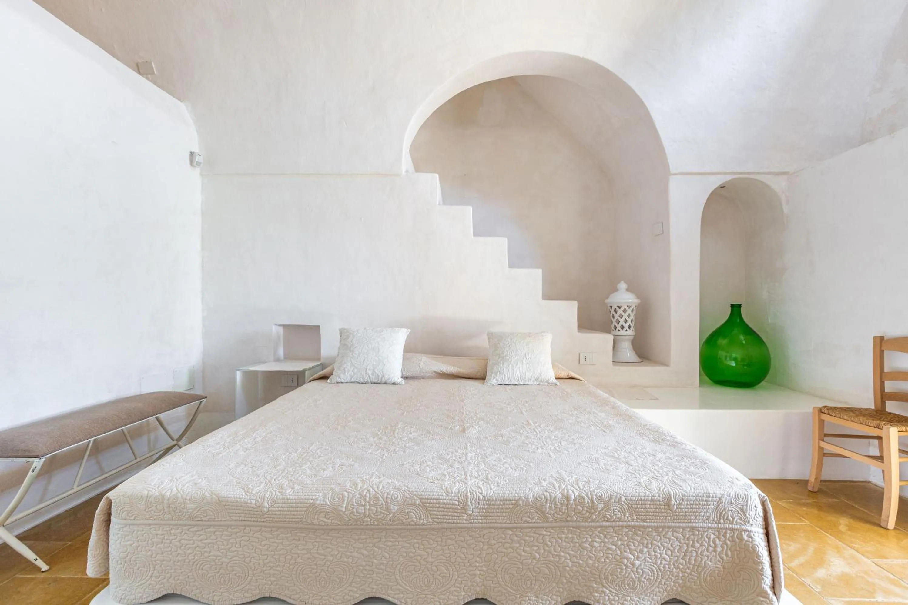Bed in Masseria Li Capperi by Perle di Puglia