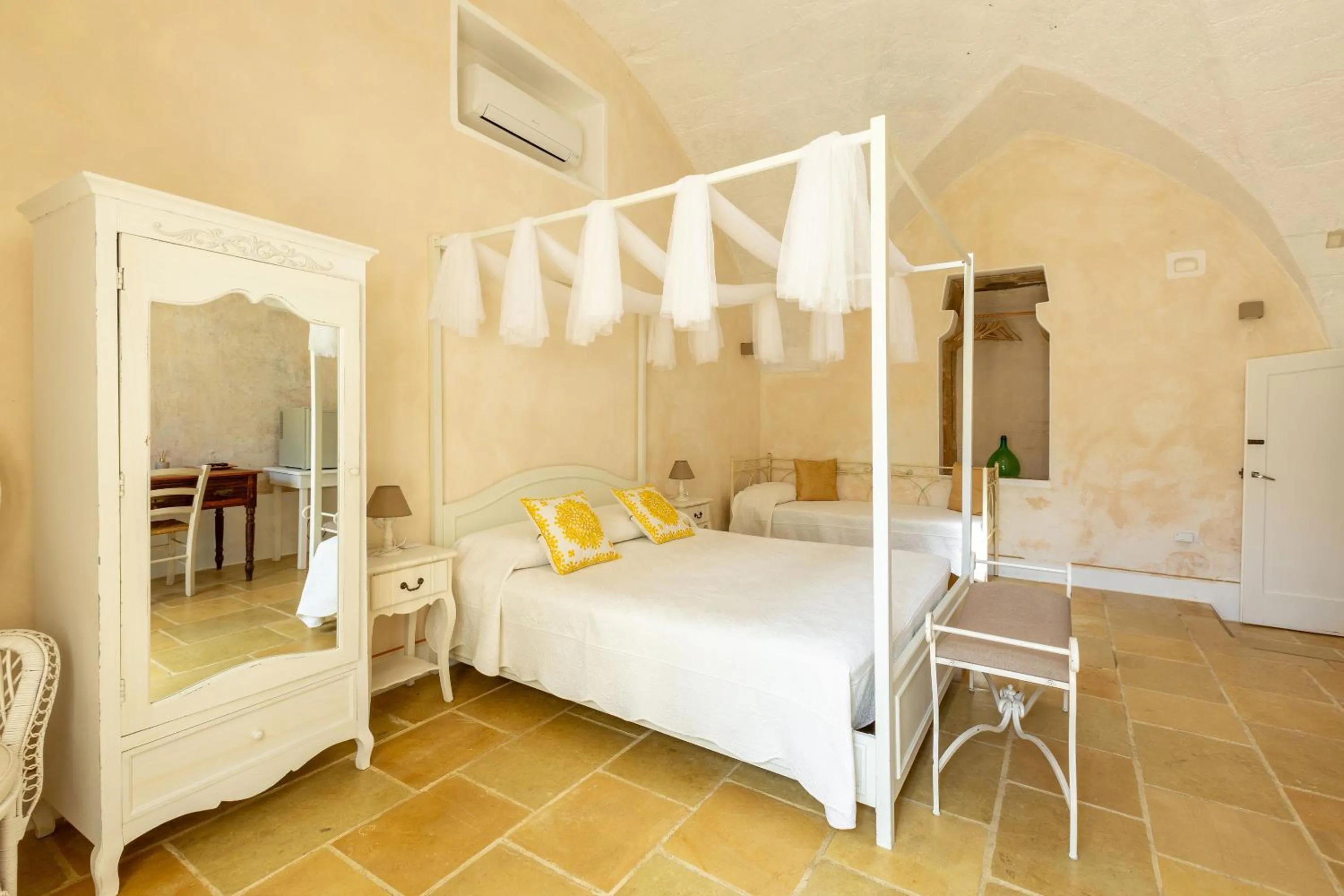 Bed in Masseria Li Capperi by Perle di Puglia