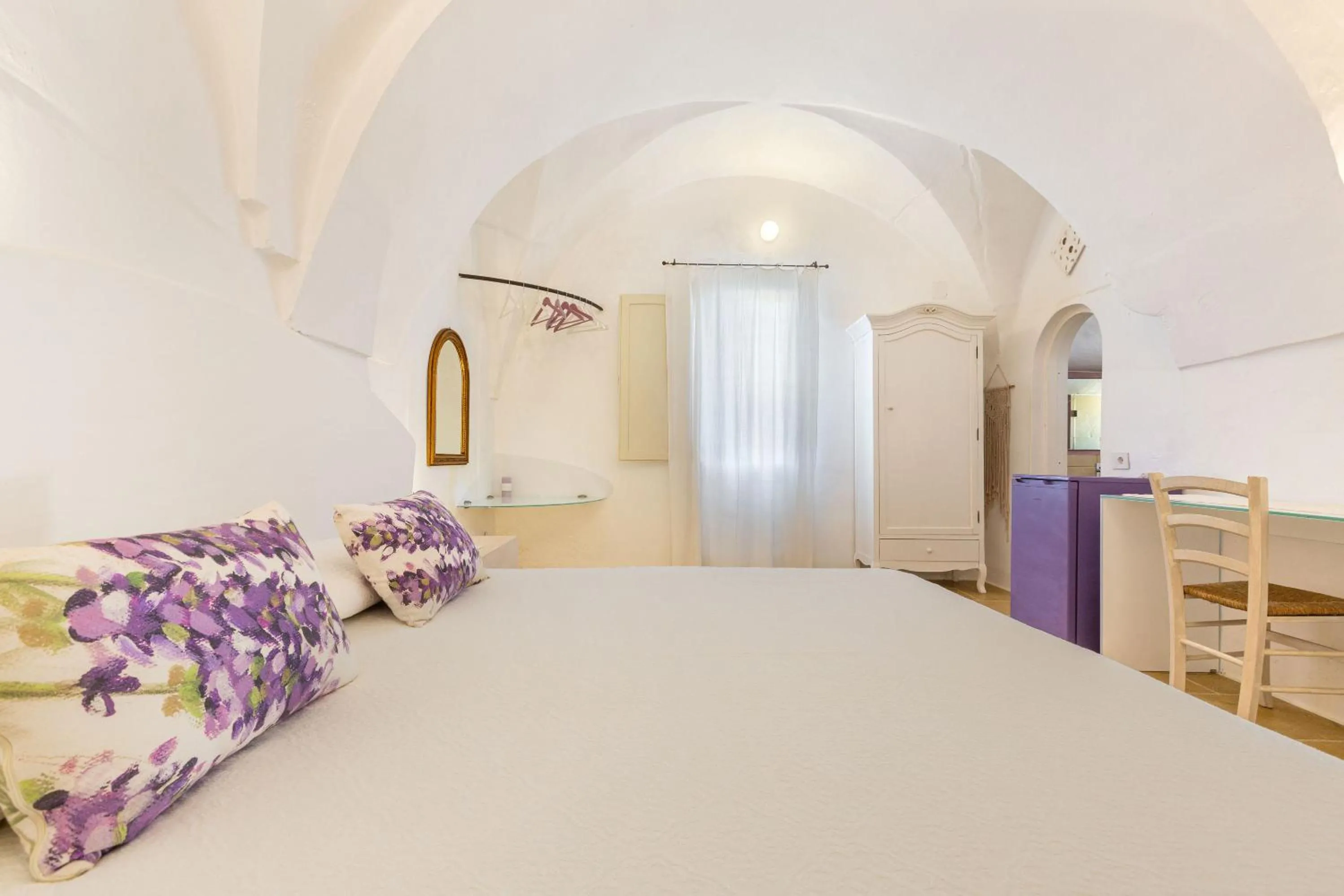 Bed in Masseria Li Capperi by Perle di Puglia