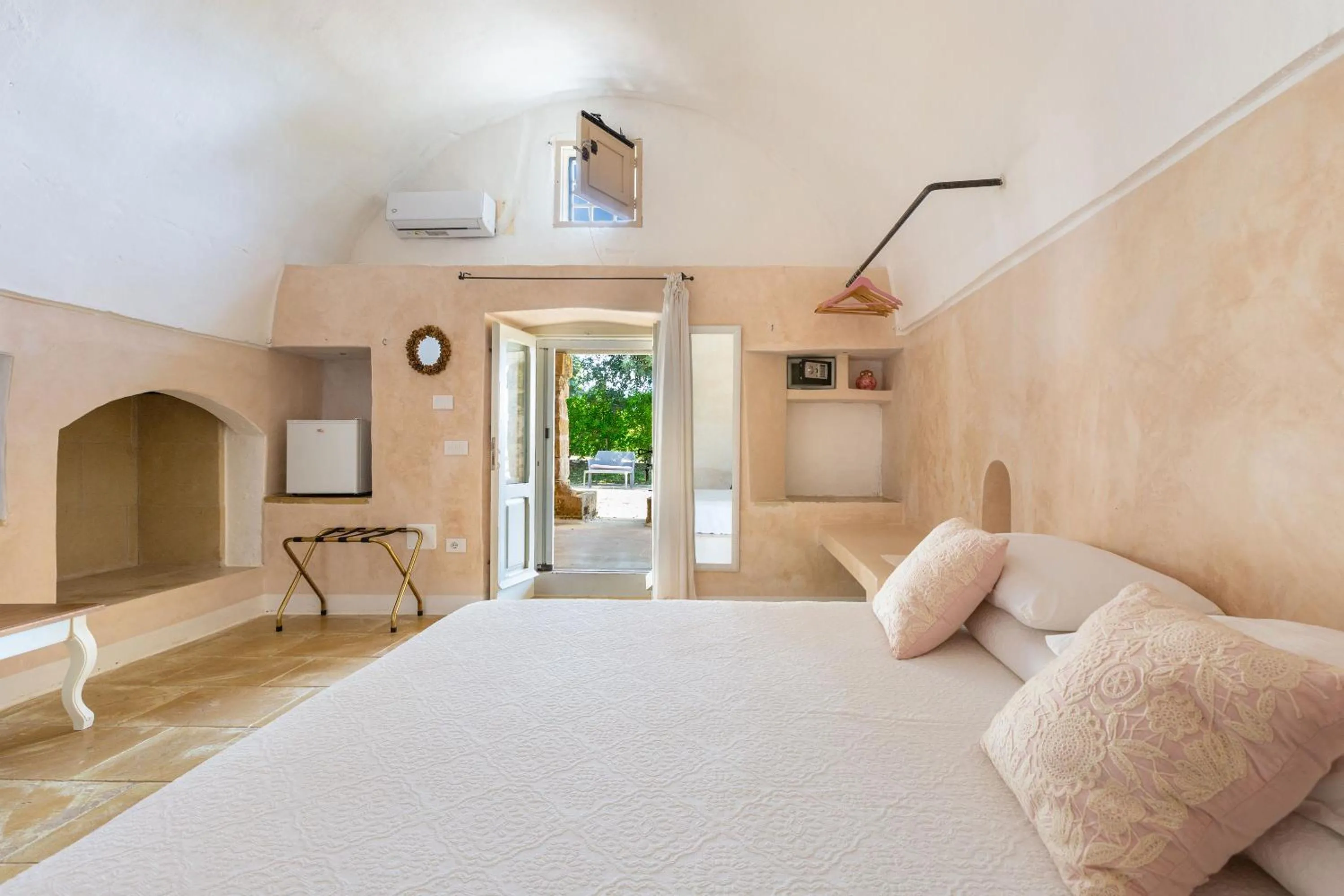Bed in Masseria Li Capperi by Perle di Puglia