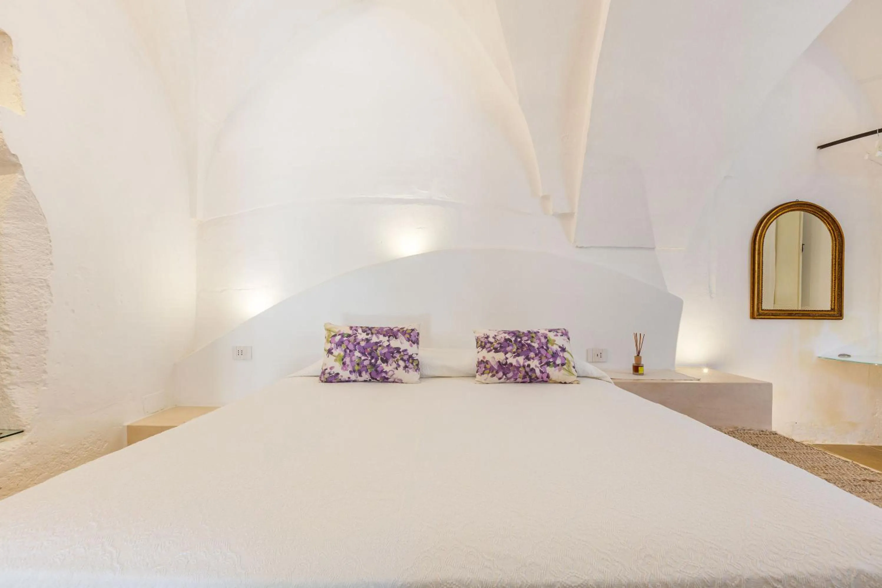 Bed in Masseria Li Capperi by Perle di Puglia
