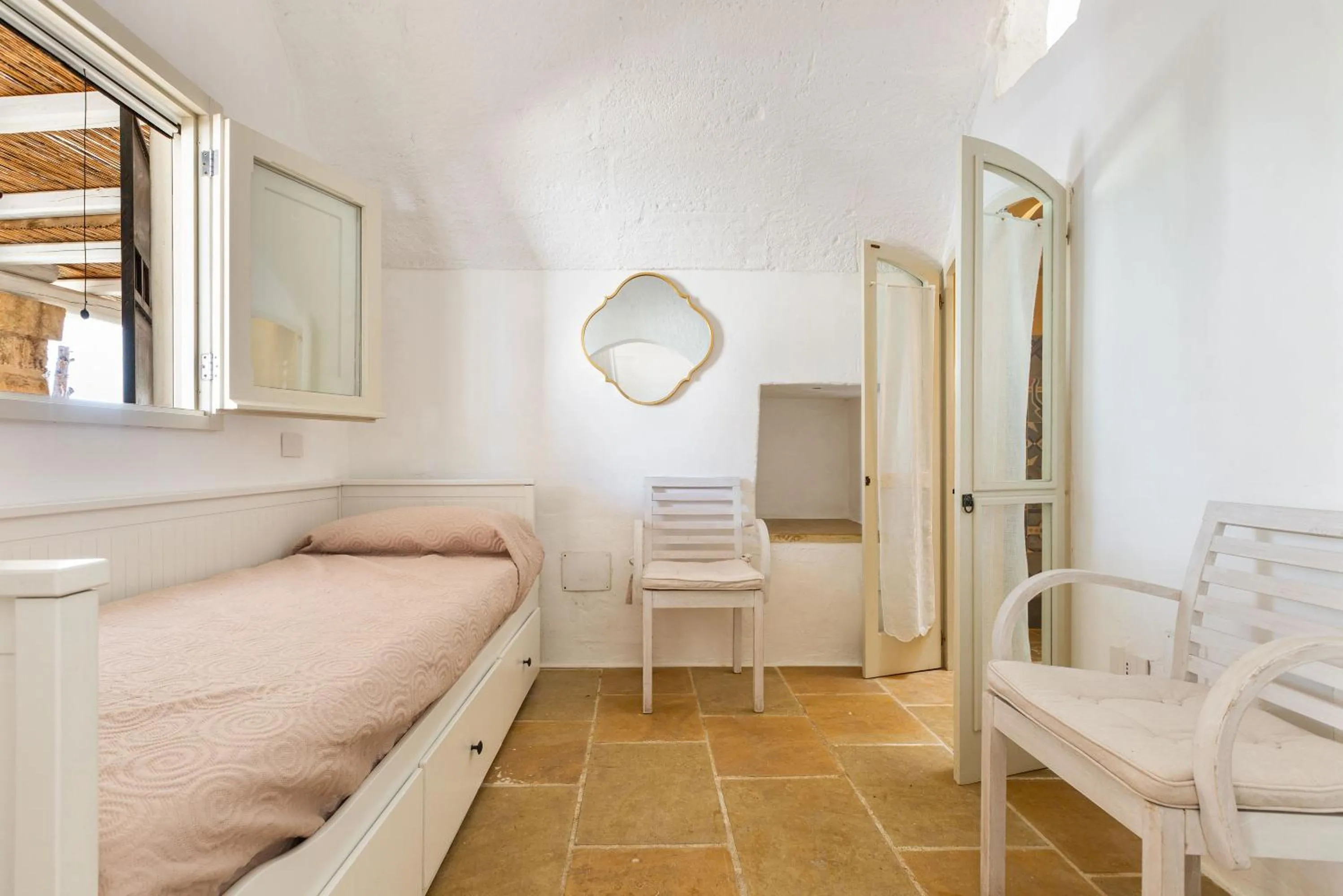Bed in Masseria Li Capperi by Perle di Puglia