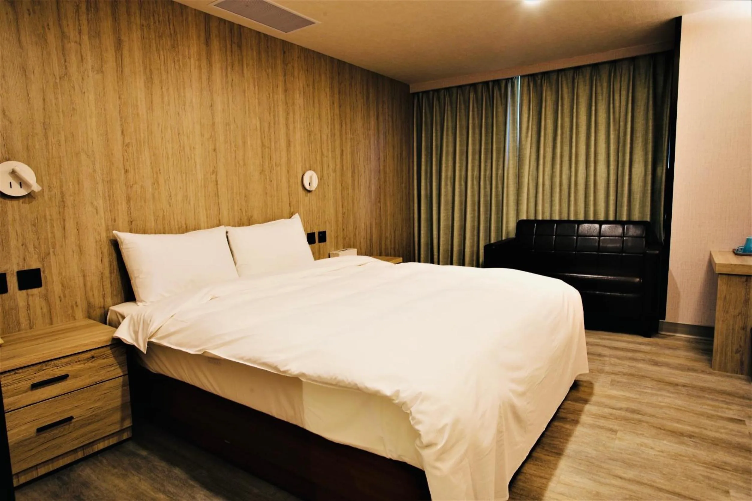 Bed in Golden Home Hotel