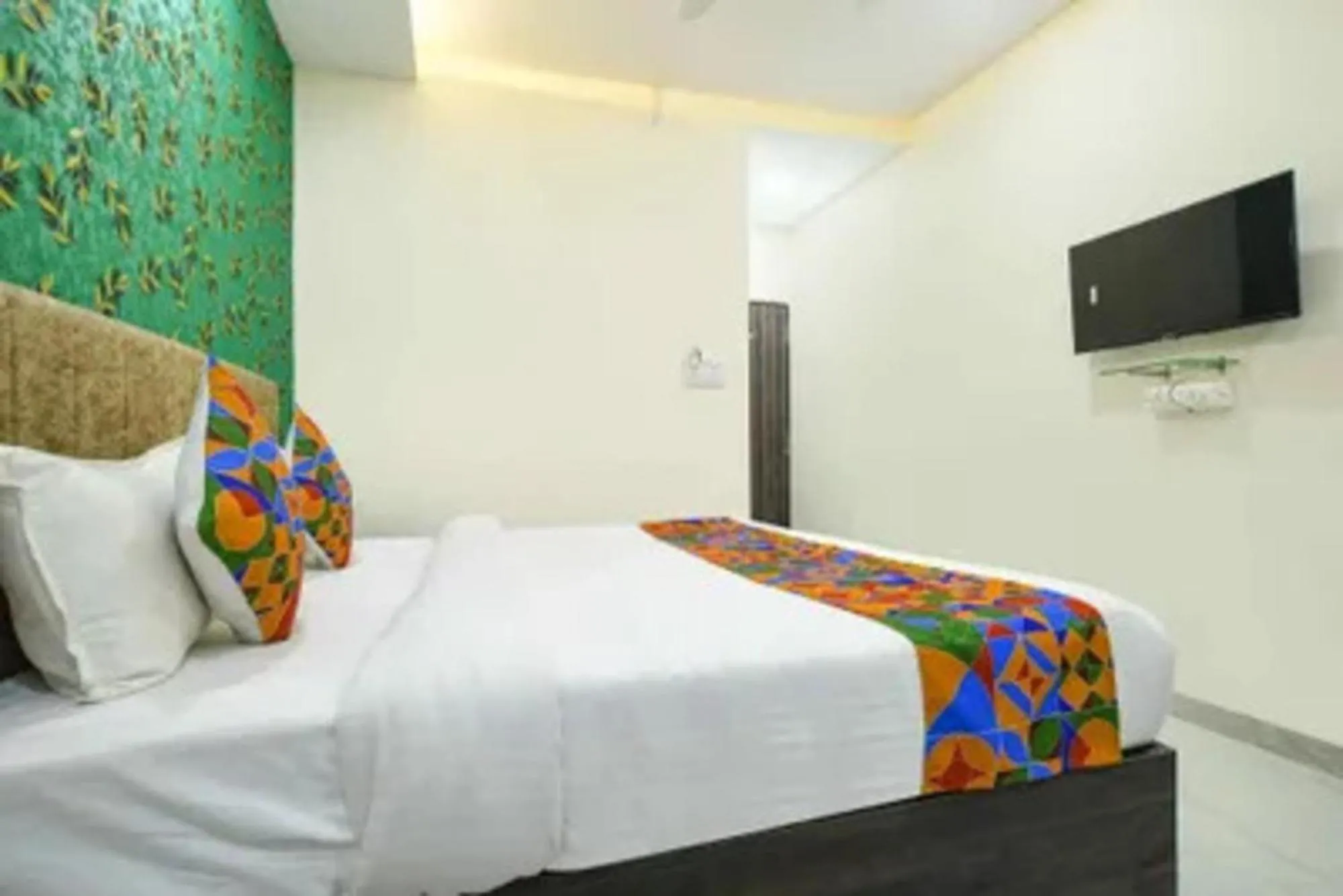 Bed in FabHotel Devs Inn