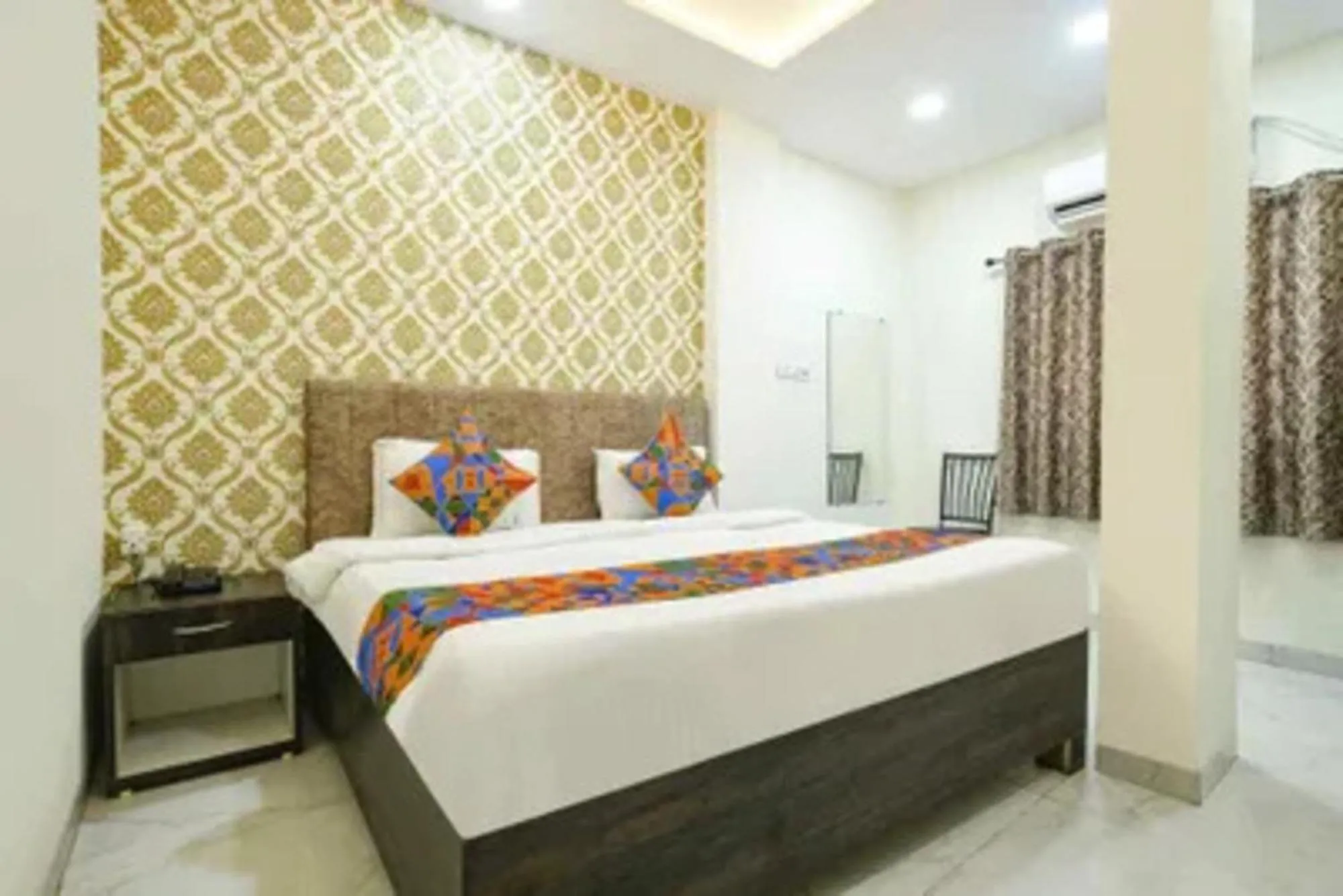 Bed in FabHotel Devs Inn