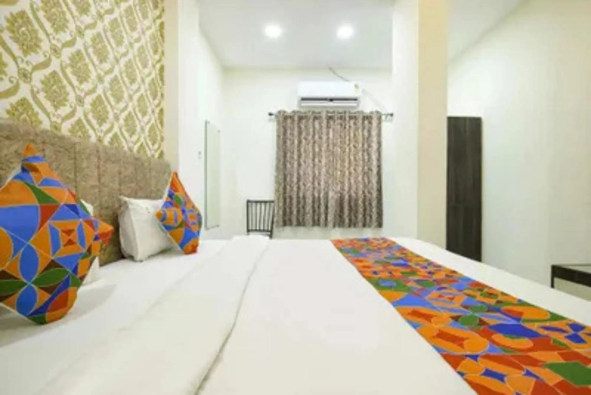 Bed in FabHotel Devs Inn