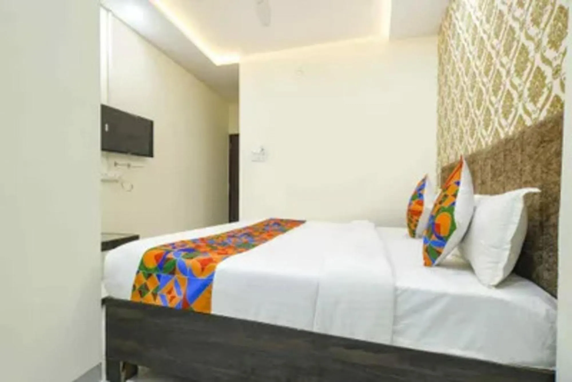 Bed in FabHotel Devs Inn