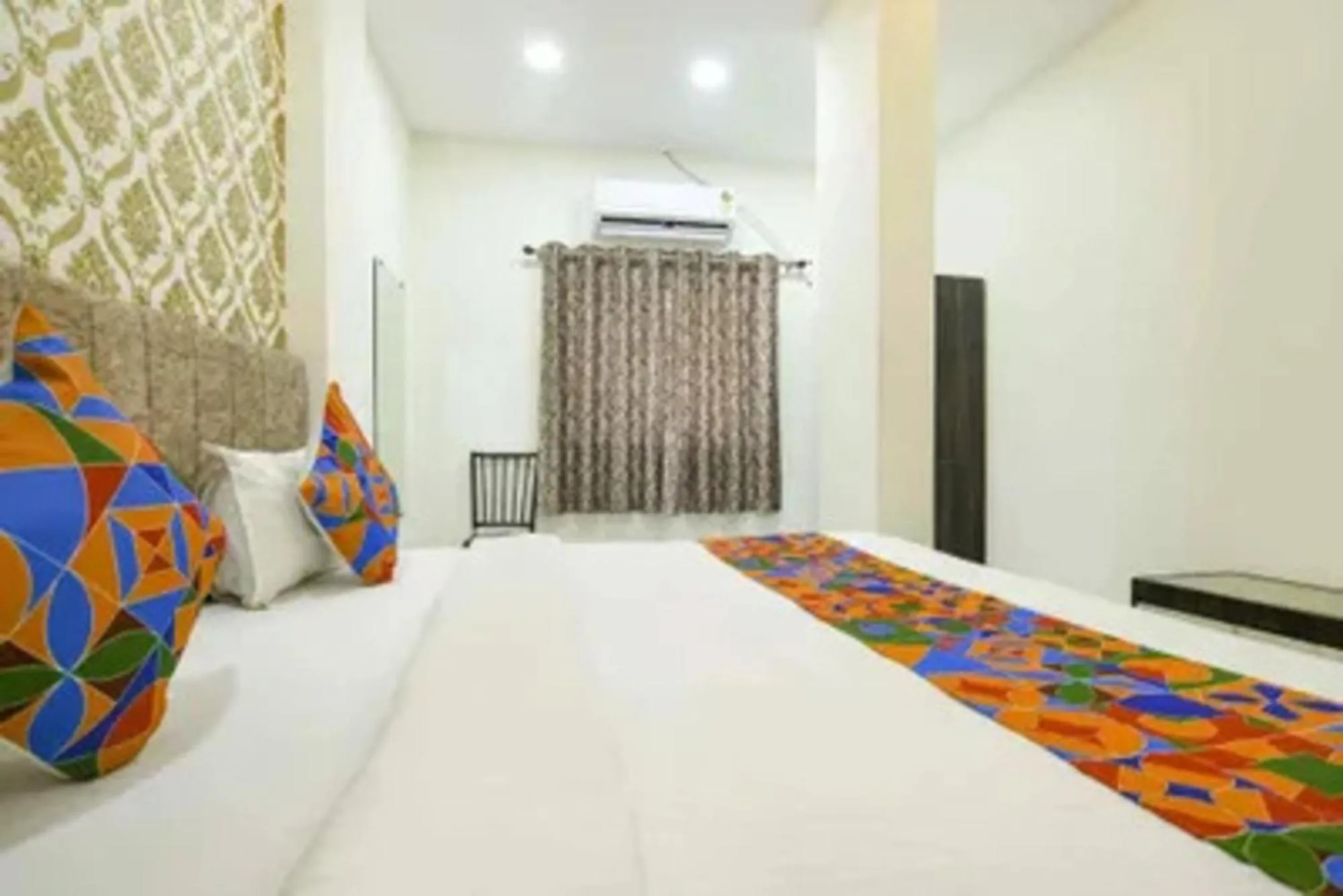 Bed in FabHotel Devs Inn