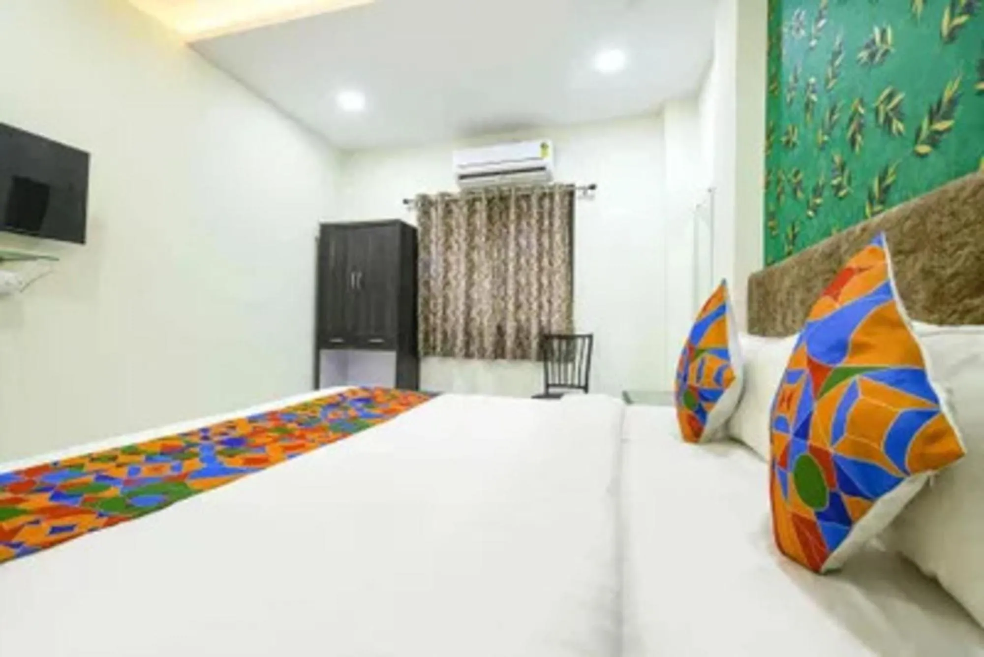 Bed in FabHotel Devs Inn