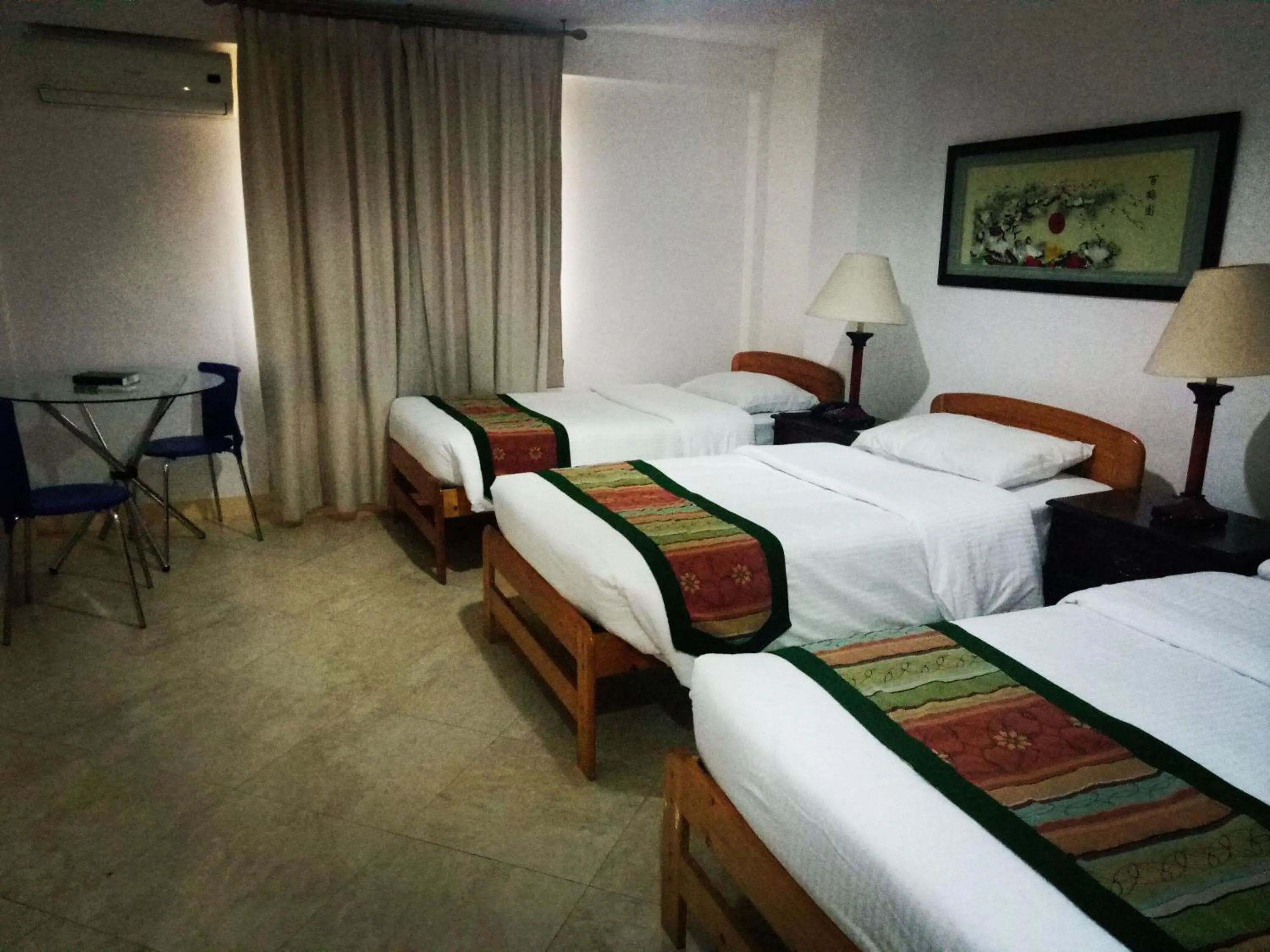 Seating area, Bed in Metro Vigan Inn