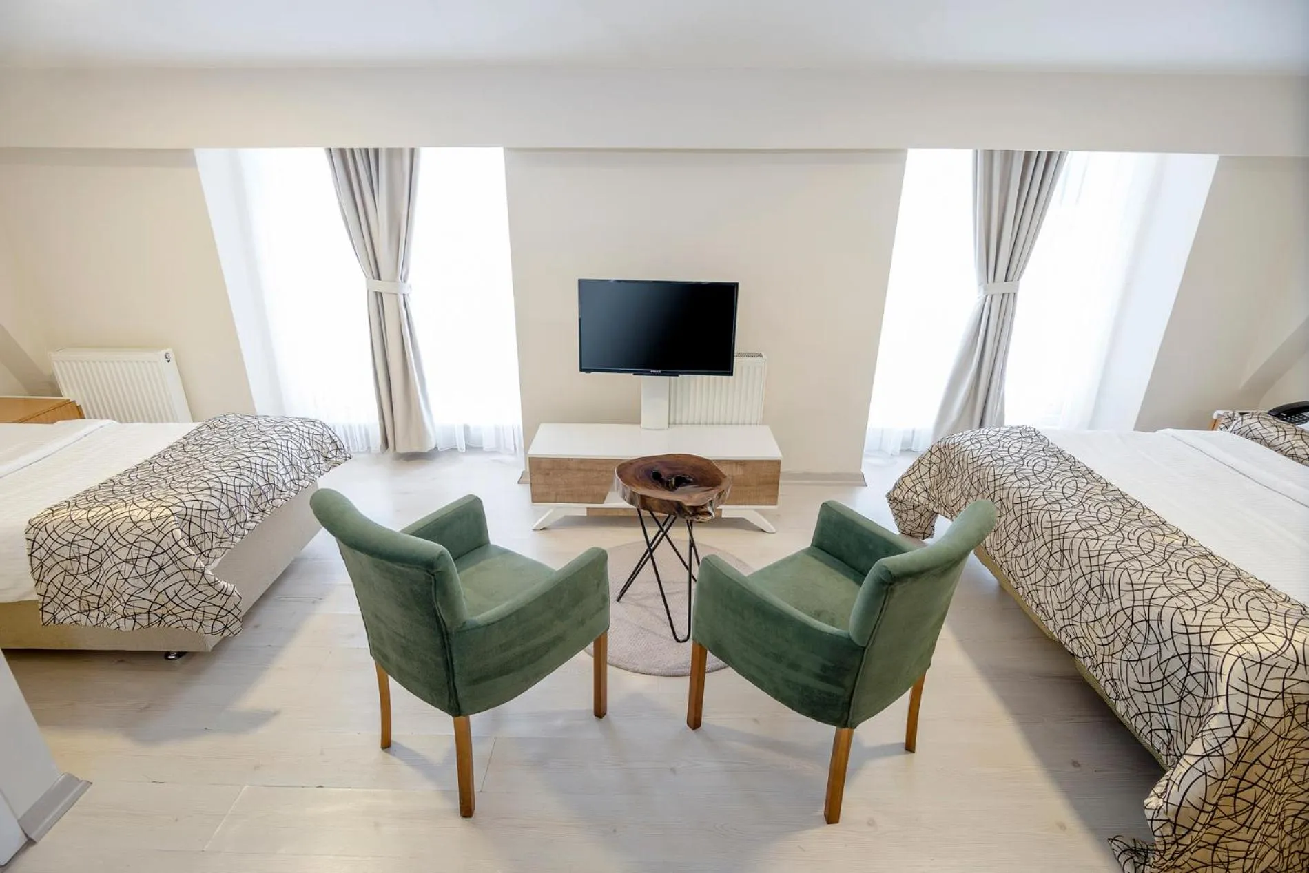 Bed in The Corner Inn Hotels By Suit