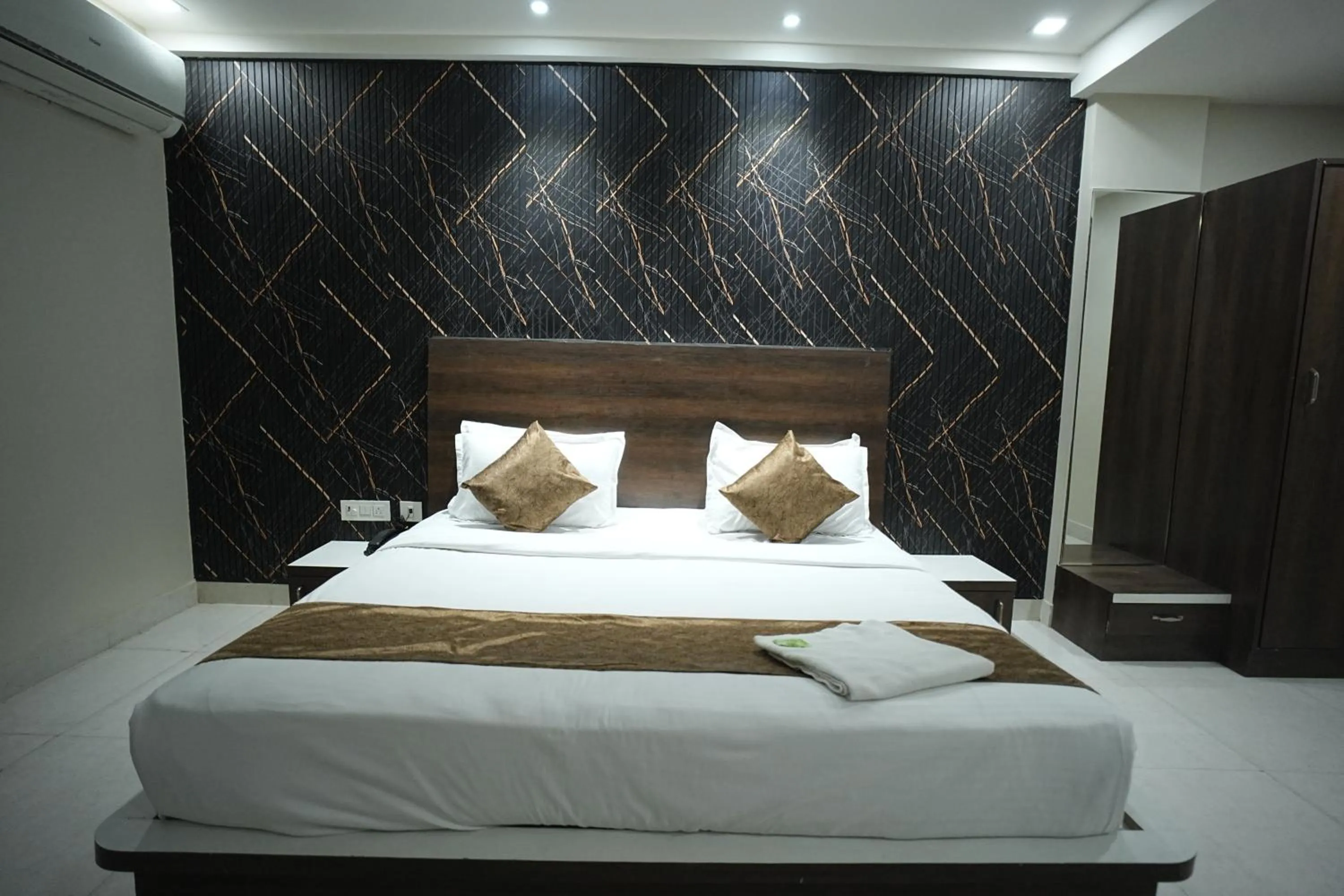 Bed in Hotel Jay Palace