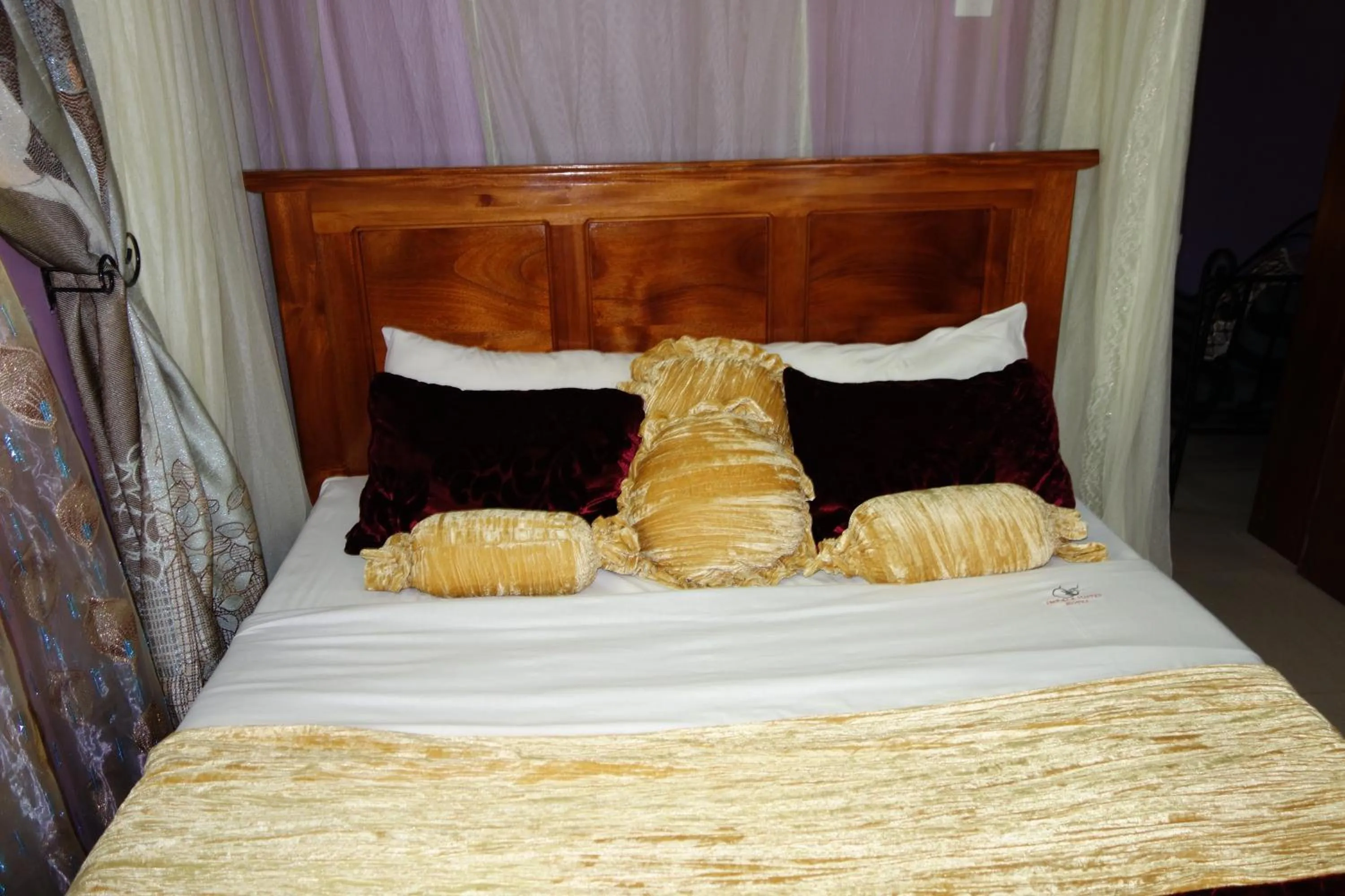 Bed in Impala Suites