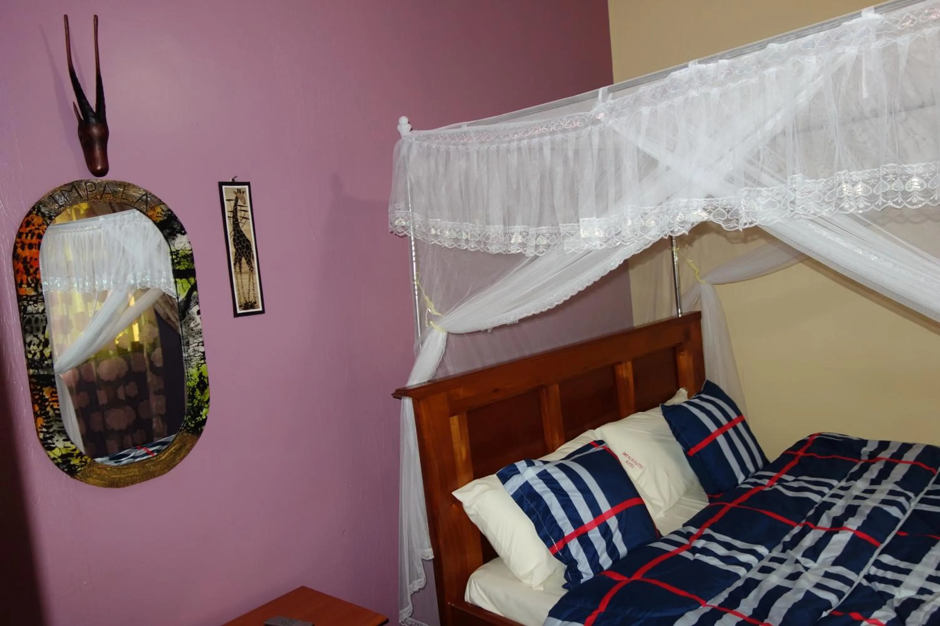 Bed in Impala Suites