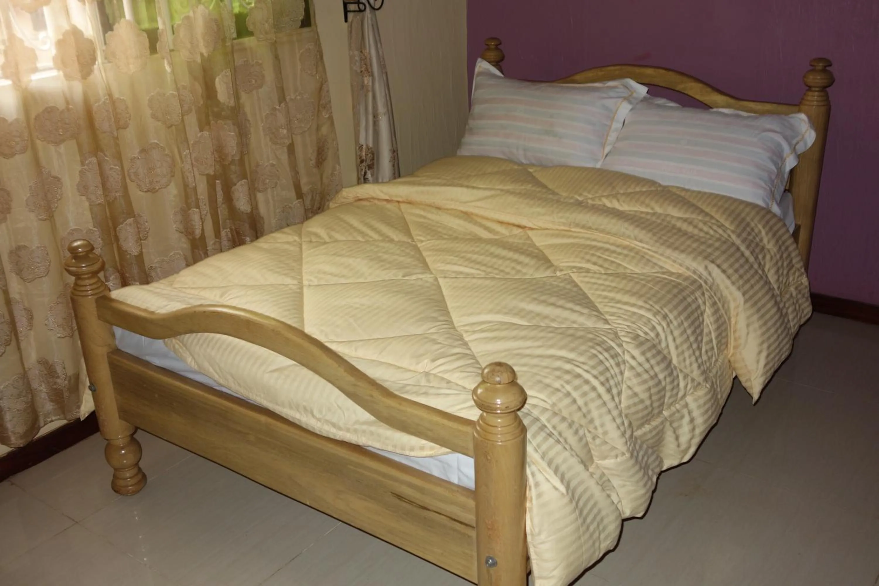 Bed in Impala Suites