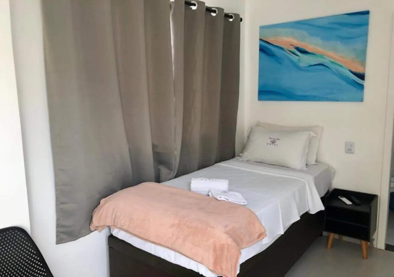 Toilet, Bed in Hotel Rosa da Ilha Guaruja - 80m do mar, 02 piscinas, sala de jogos, brinquedão de percurso para crianças