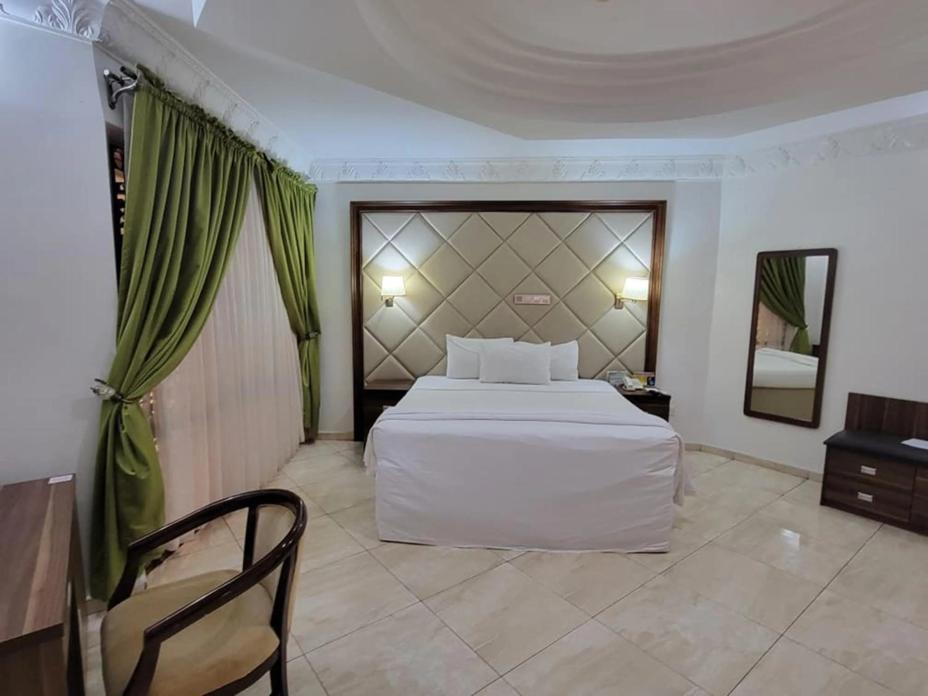 Seating area, Bed in Valencia Hotels Abuja