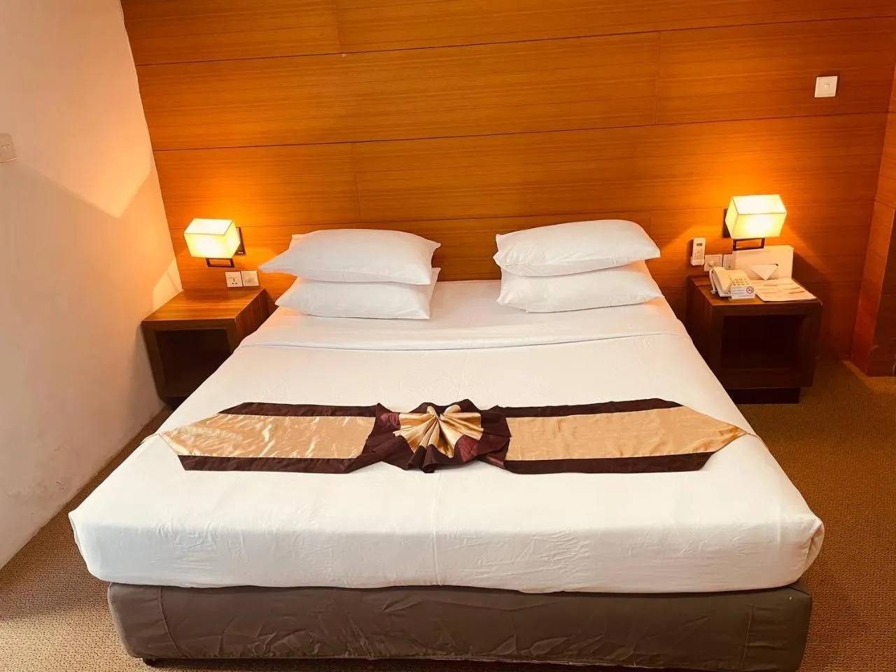 Bed in YAMA HOTEL & ROOFTOP BAR