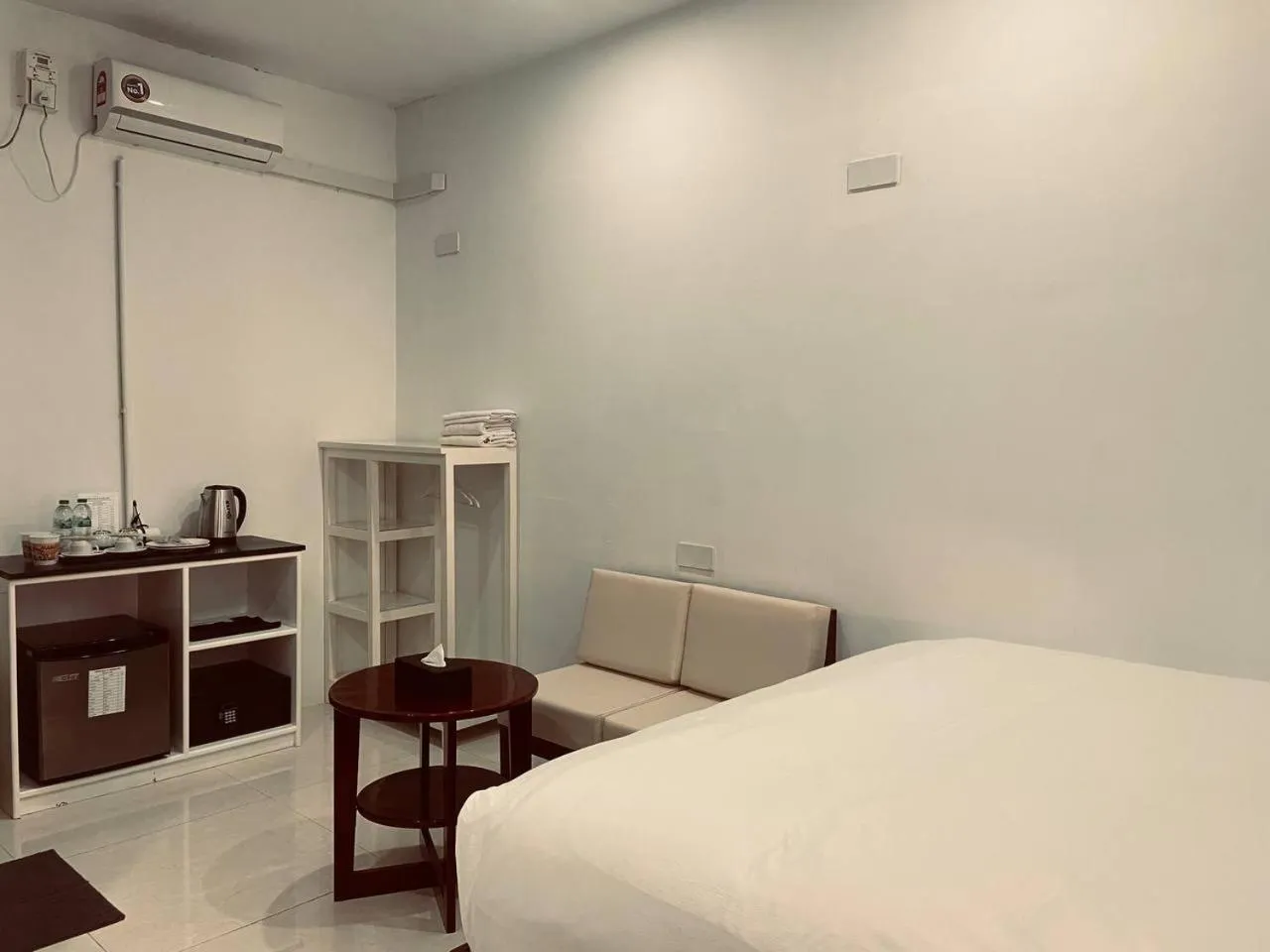 Living room, Bed in YAMA HOTEL & ROOFTOP BAR